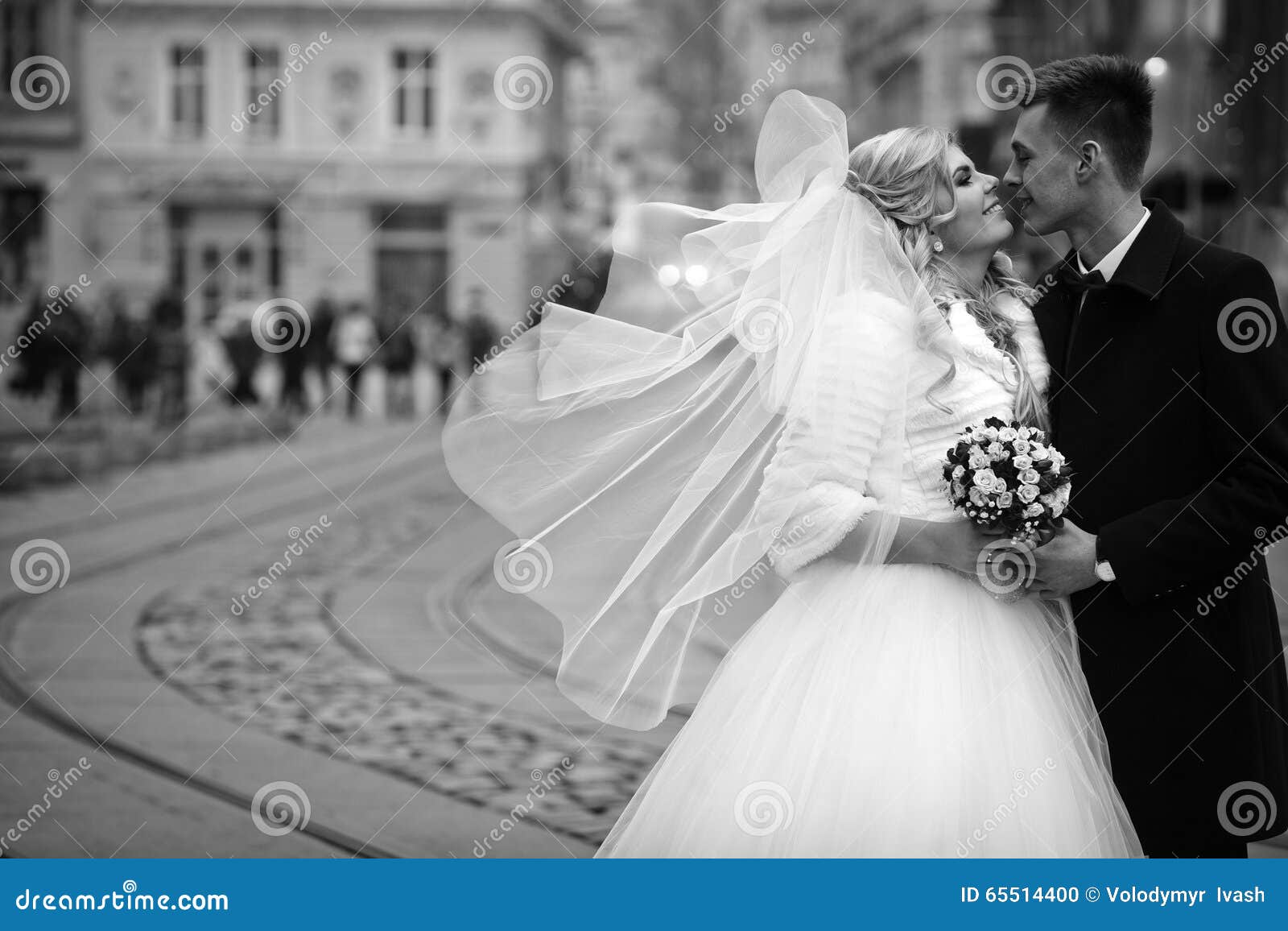 happy couple of newlywed valentynes posing and kissing in old eu