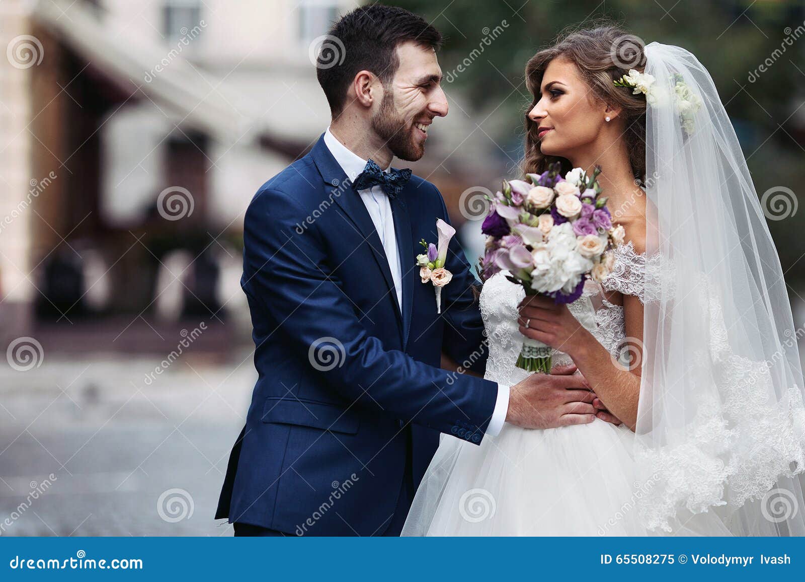 happy couple of newlyweds valentynes posing and hugging in old e