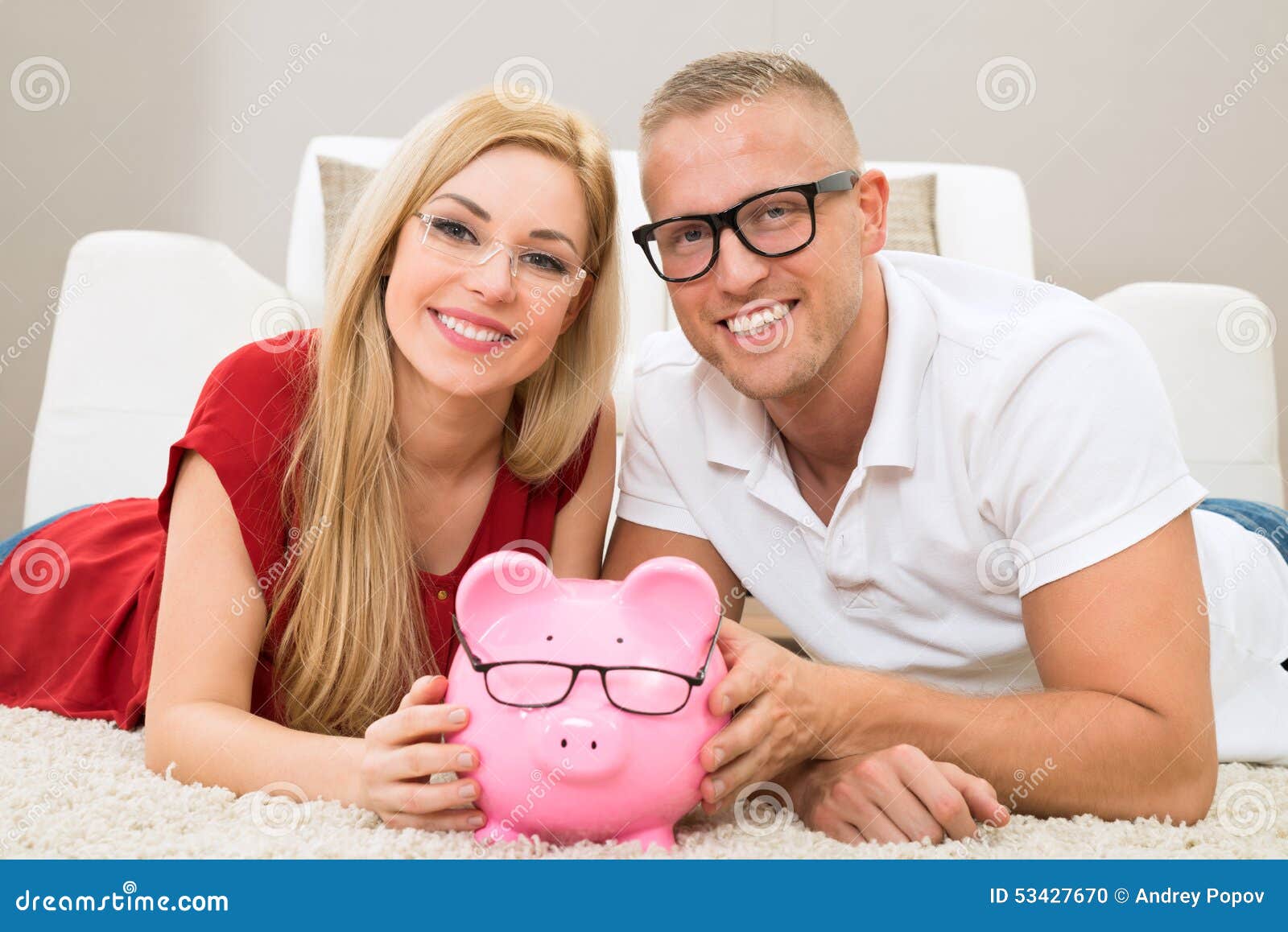 happy couple with piggybank