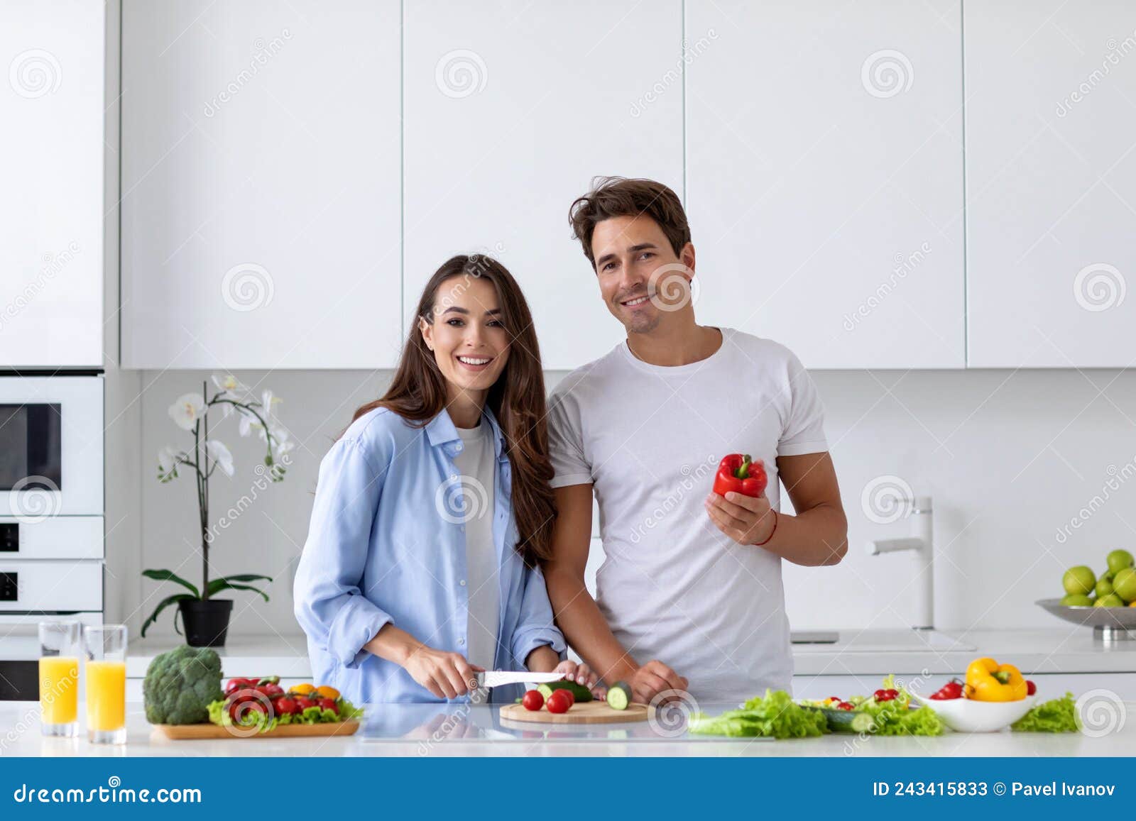 Happy Couple is Preparing Healthy Food on Light Kitchen, Enjoy Morning