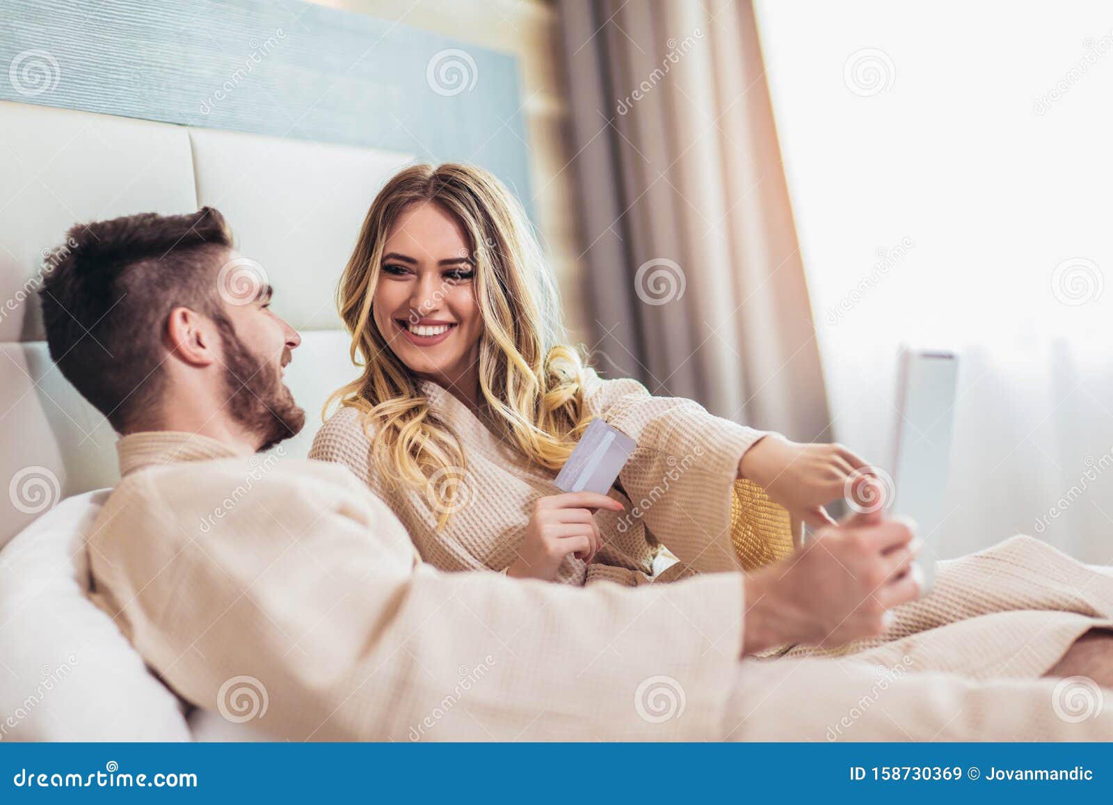 Happy Couple Shopping Online In Luxury Hotel Room Stock Image Im