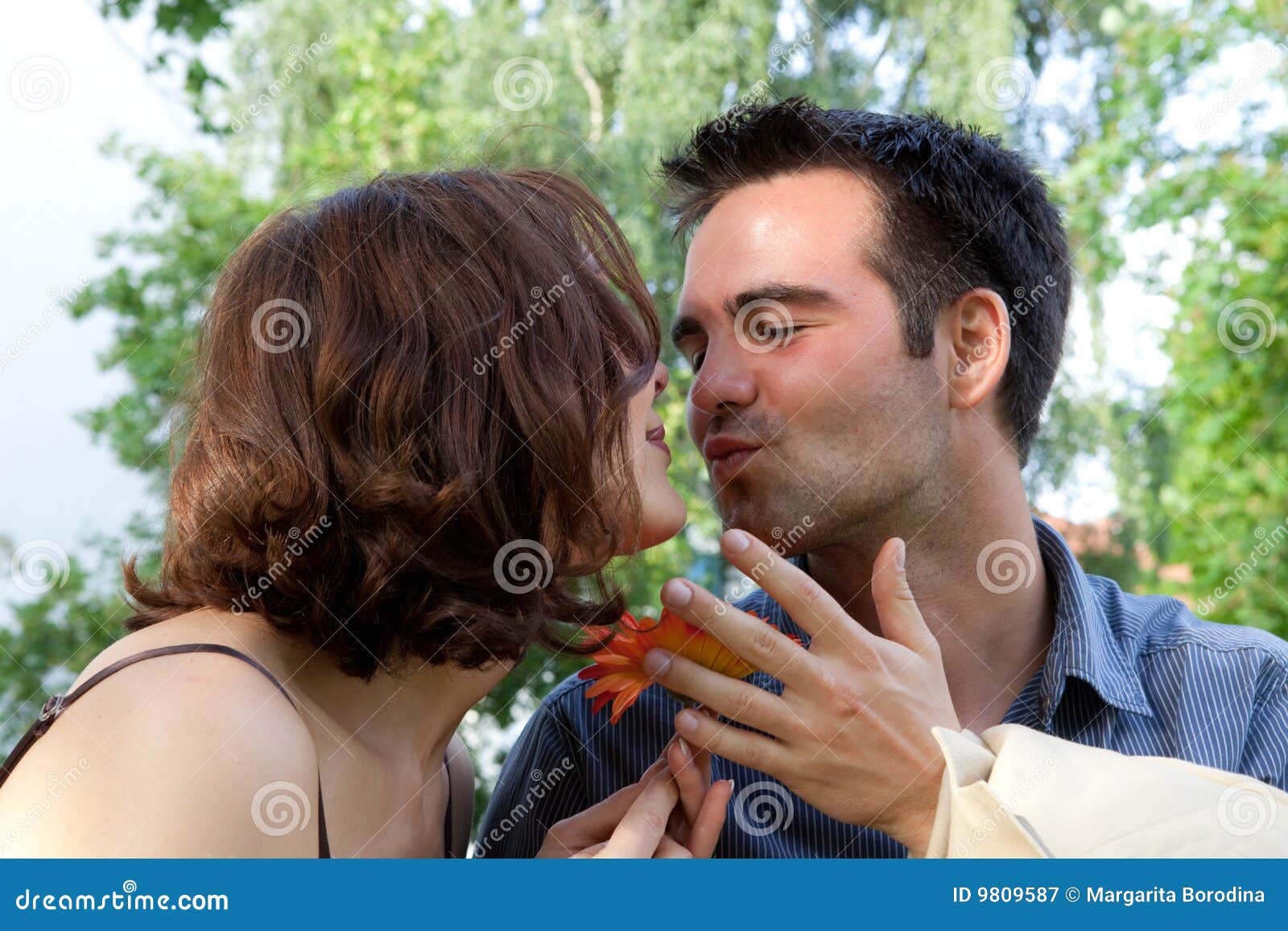  Happy  Couple  Sitting Nearby The Street And Hugging Stock 