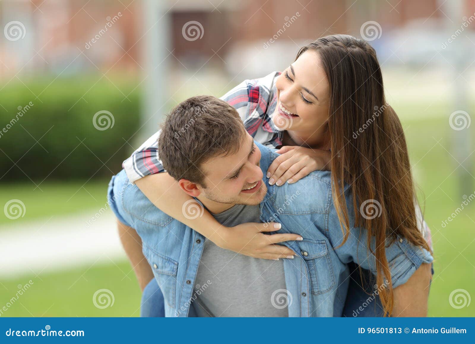 Happy Couple Of Teens Joking Outdoors Stock Ima