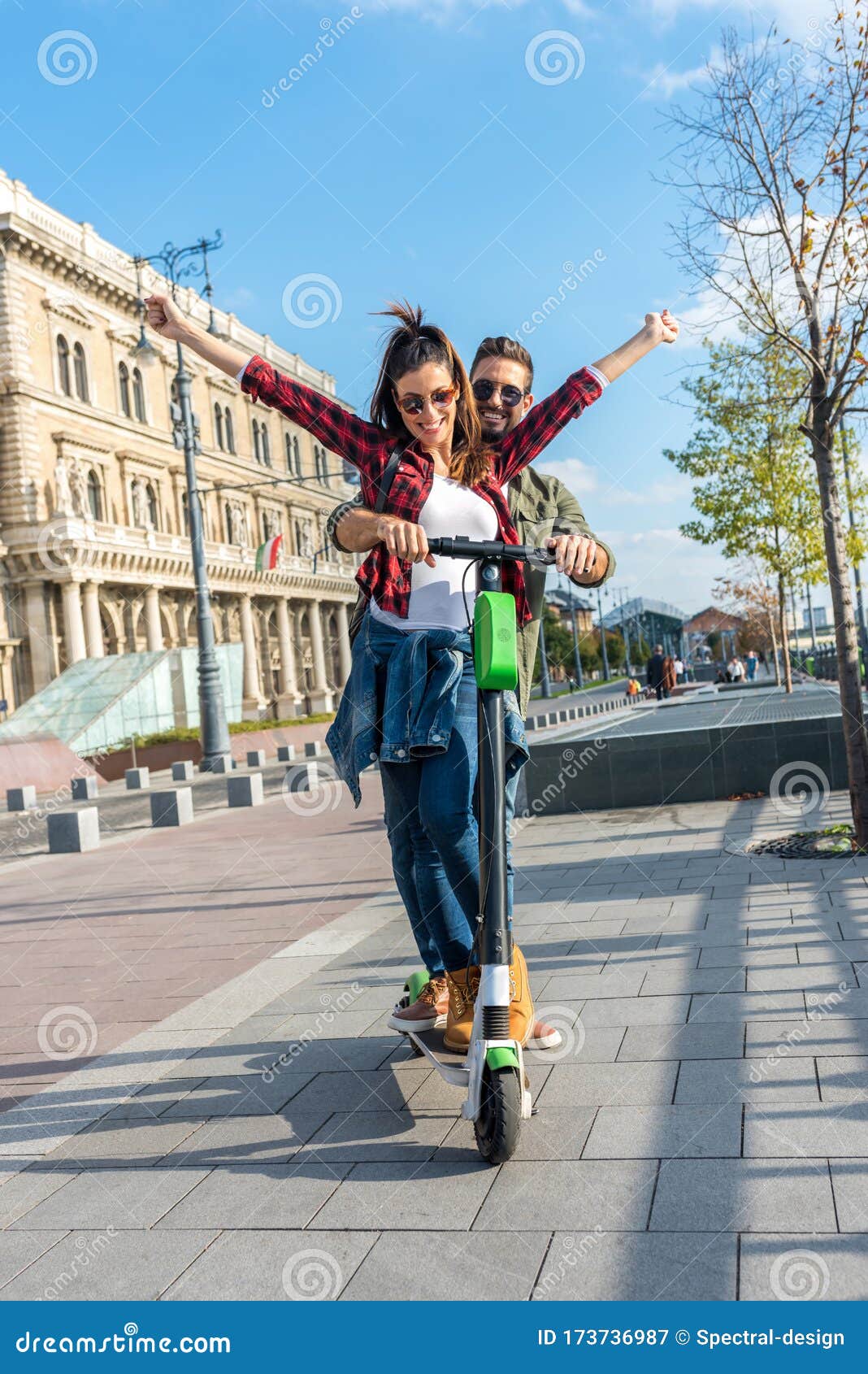 A Happy Couple Using a Electric Scooter in a European City Stock Image ...