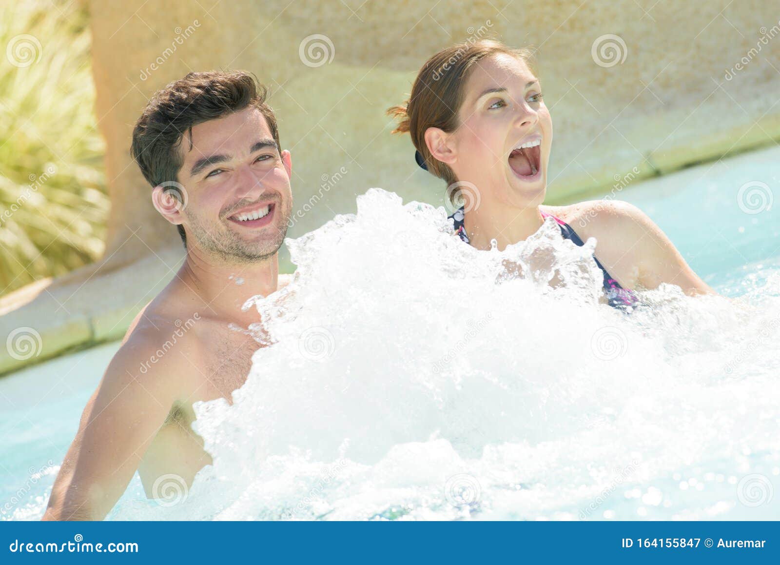 Happy couple using jacuzzi stock image. Image of gush 164155847