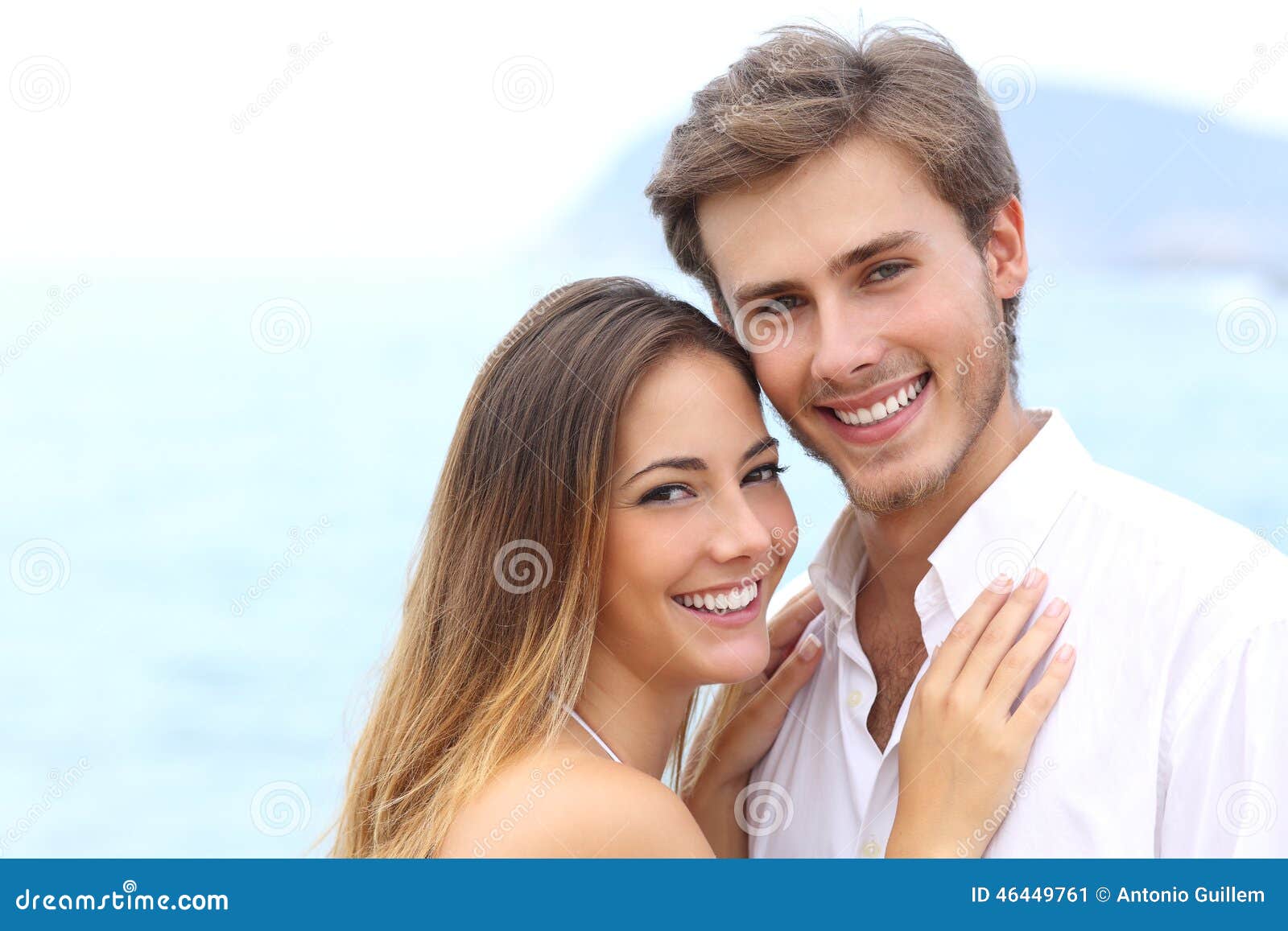 happy couple with a white smile looking at camera