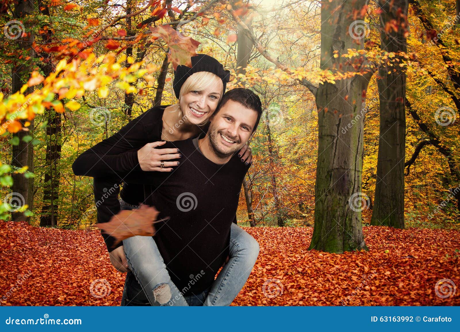 happy couples in autumn forest