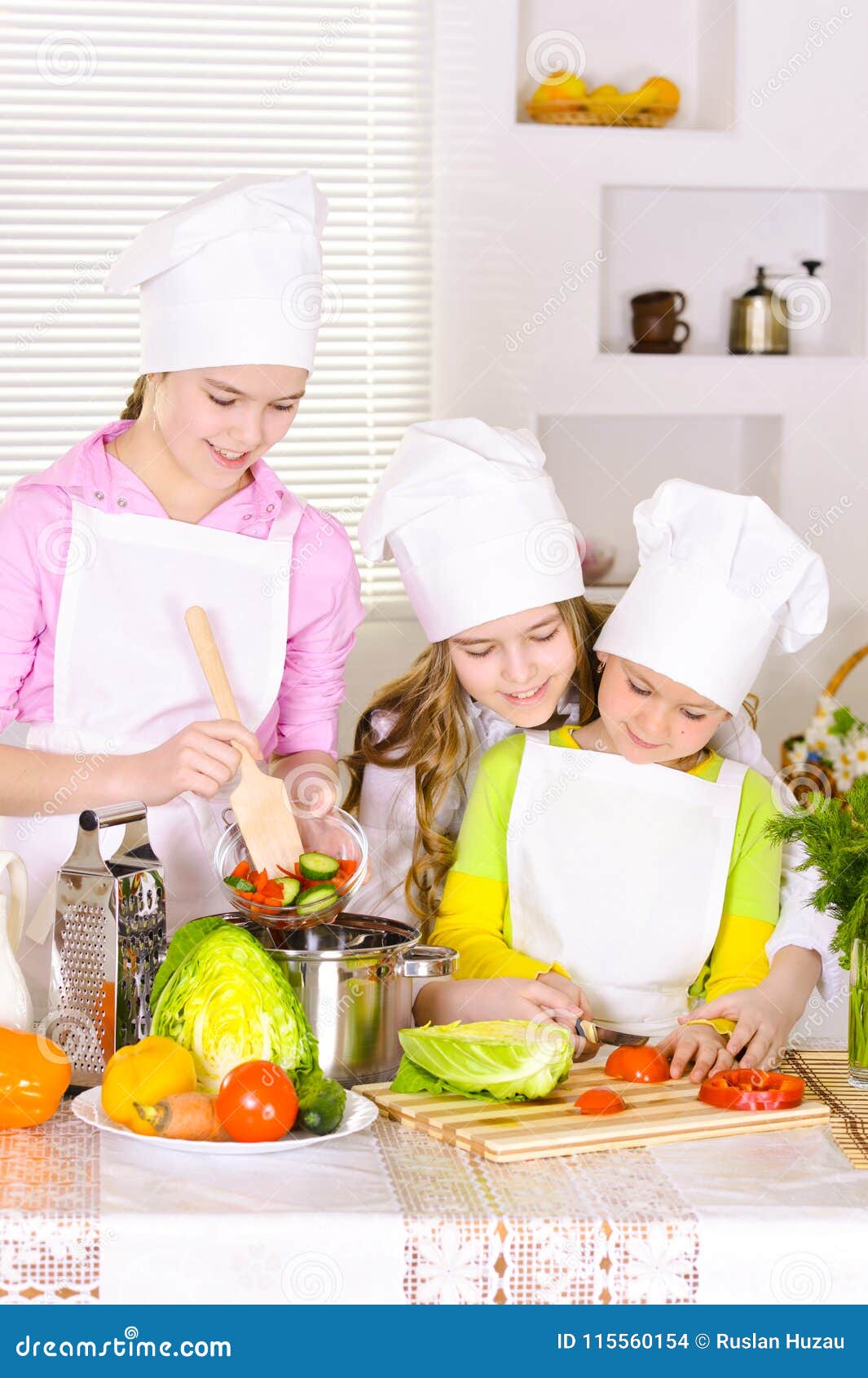 Happy Cute Girls Cooking Vegetable Dish Stock Photo - Image of kids