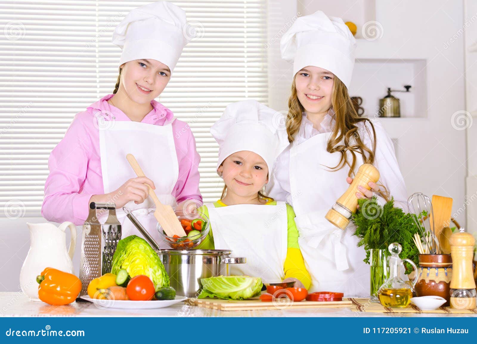 Happy Cute Girls Cooking Vegetable Dish Stock Image - Image of cute