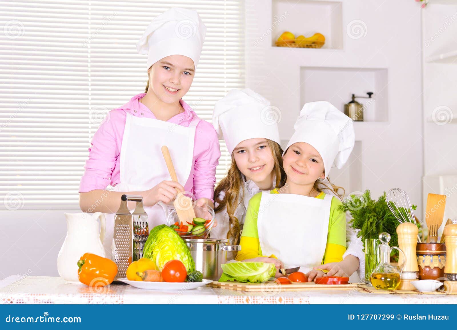 Portrait of Happy Cute Girls Cooking Vegetable Dish Stock Image - Image