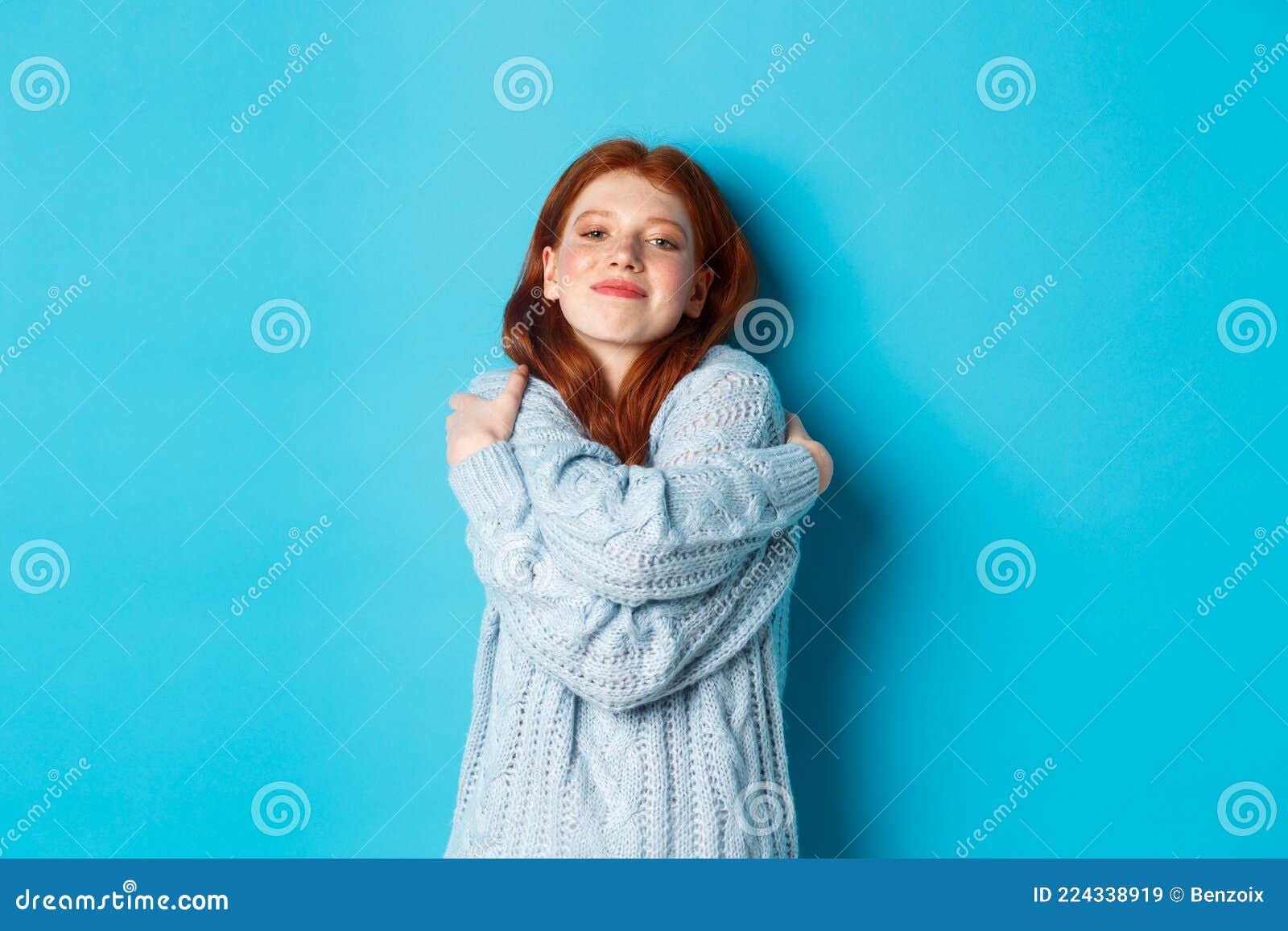 Happy Cute Redhead Girl Hugging Herself, Wearing Comfortable and Warm ...