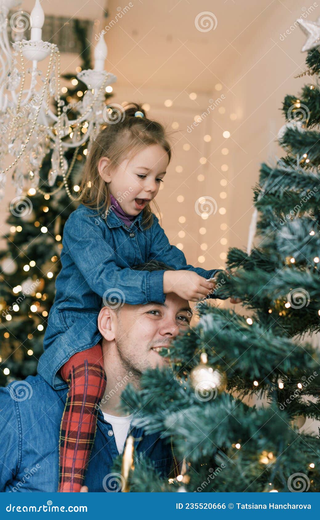 Happy Dad and Daughter Decorate the Christmas Tree. Little Girl Sitting ...