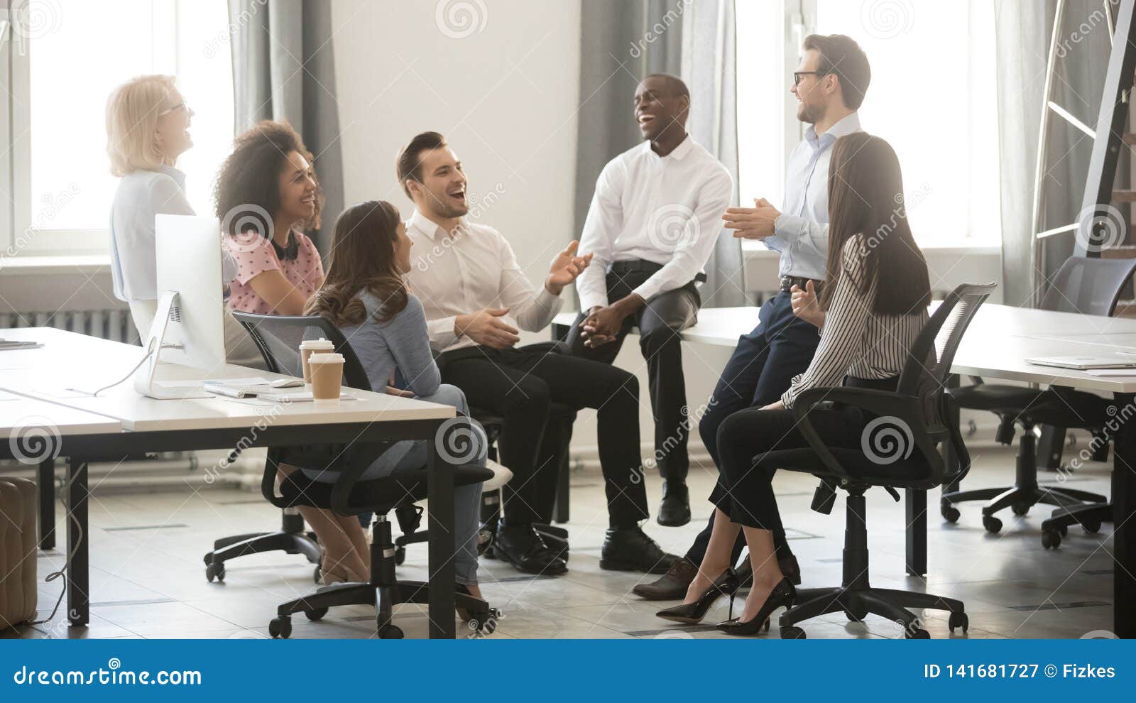 happy diverse business team employees having fun at corporate meeting