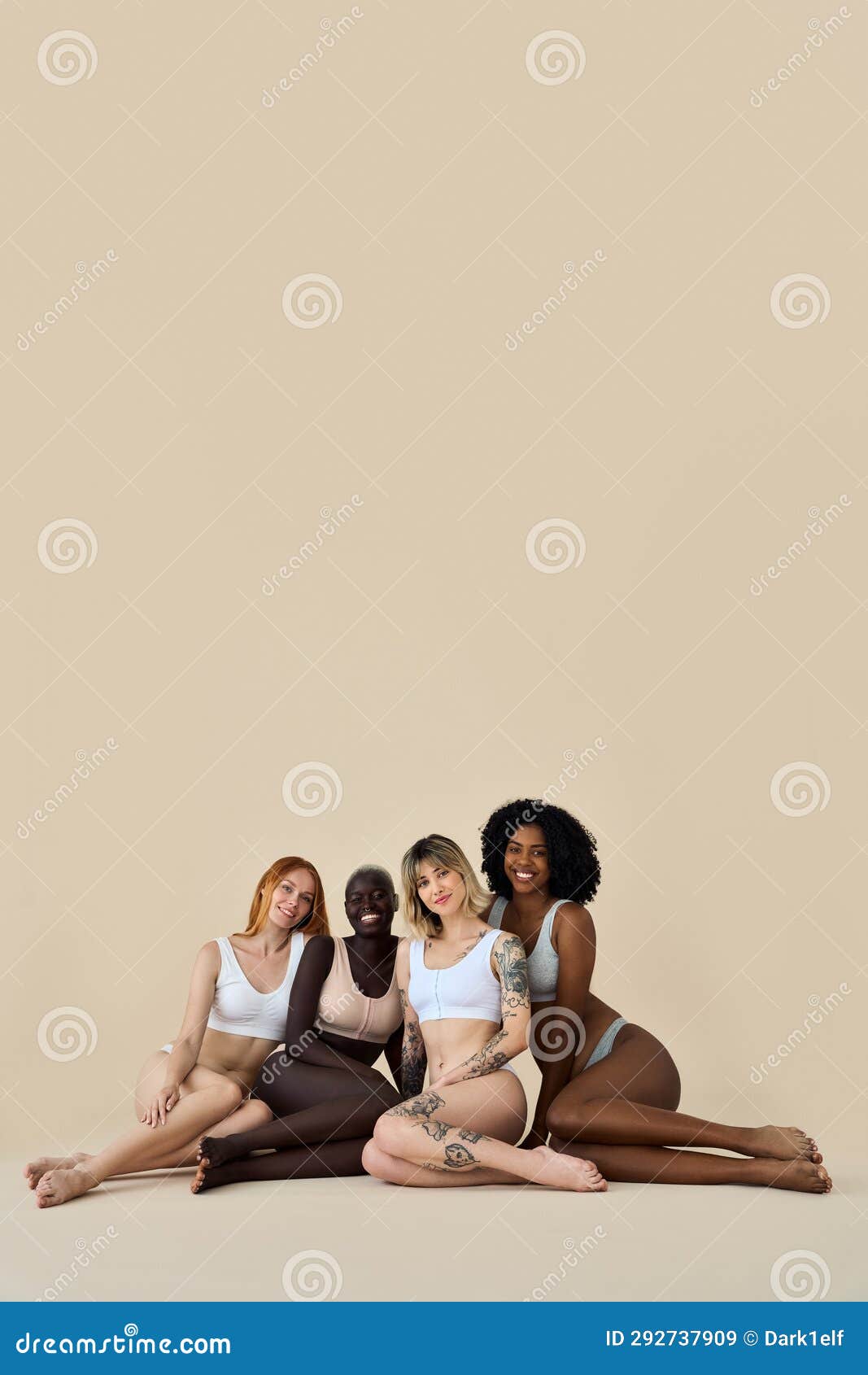 Diverse young women wear underwear sitting showing legs on beige