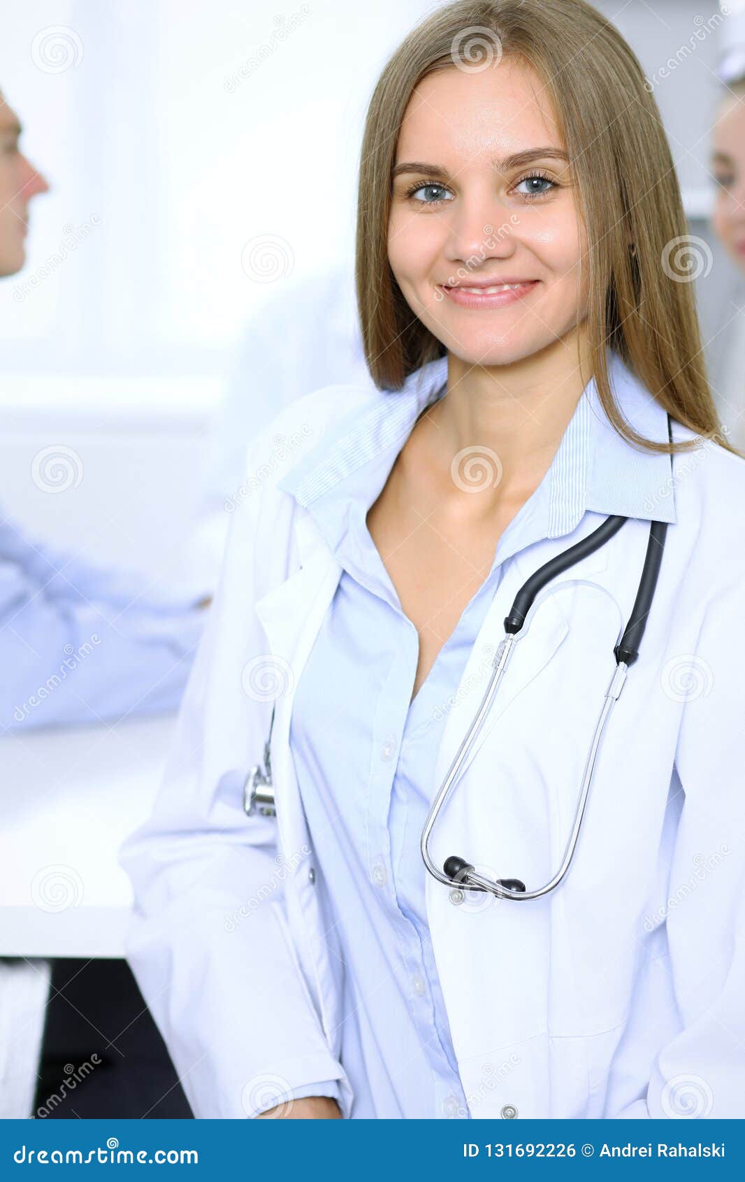 Happy Doctor Woman with Medical Staff at the Background in Hospital ...