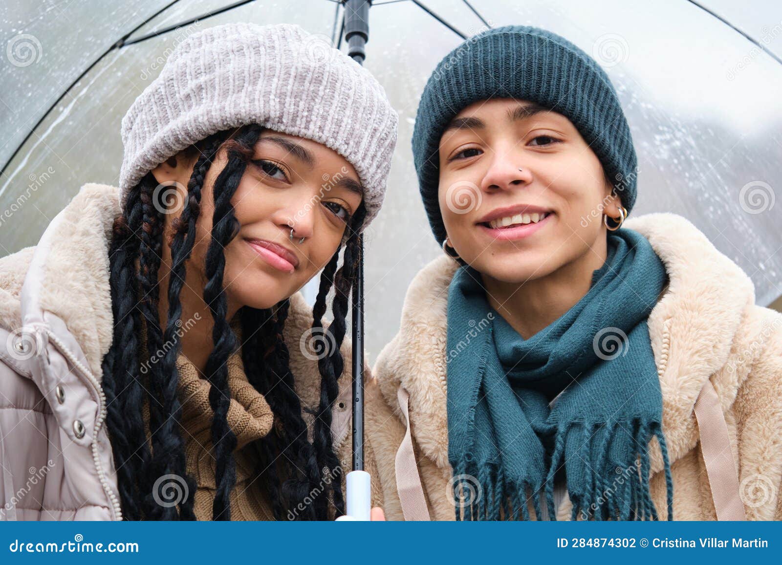 Happy Dominican Lesbian Couple With An Umbrella Street In A Rainy Day 