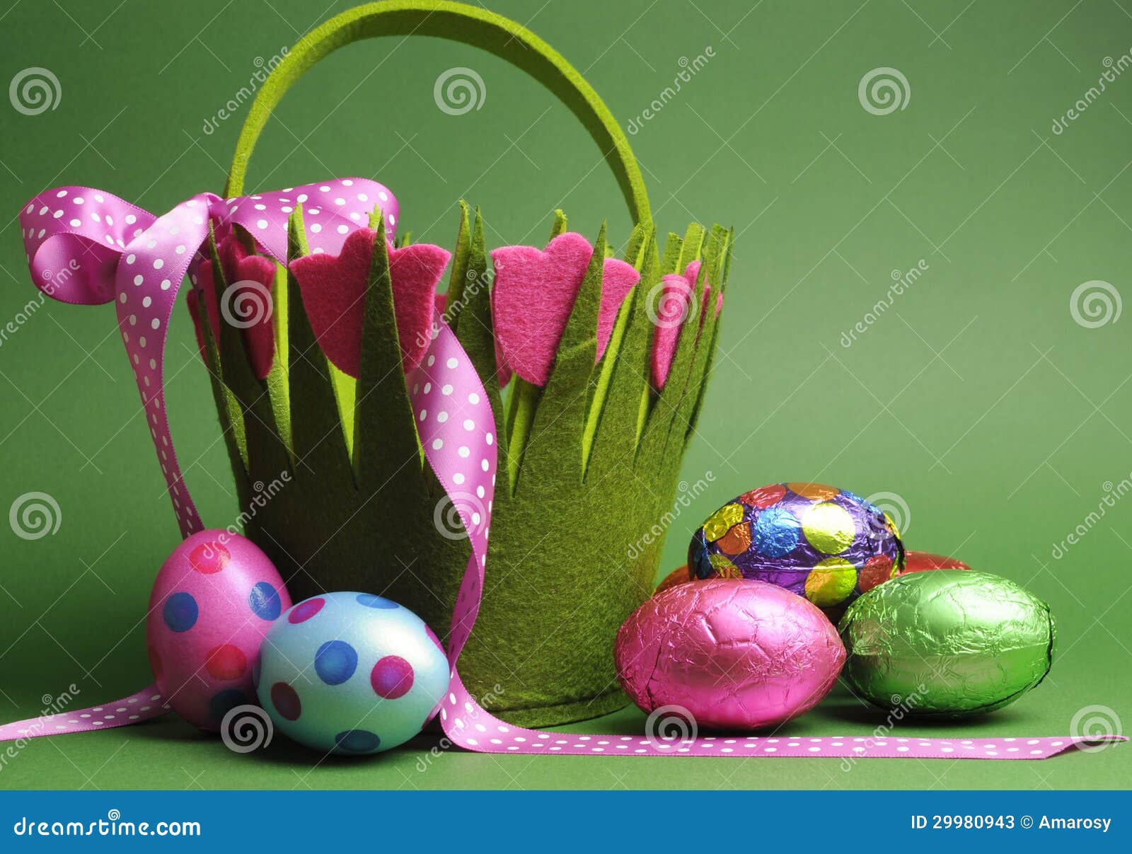 easter egg hunt with colorful spring theme polka dot carry basket bag and chocolate easter eggs