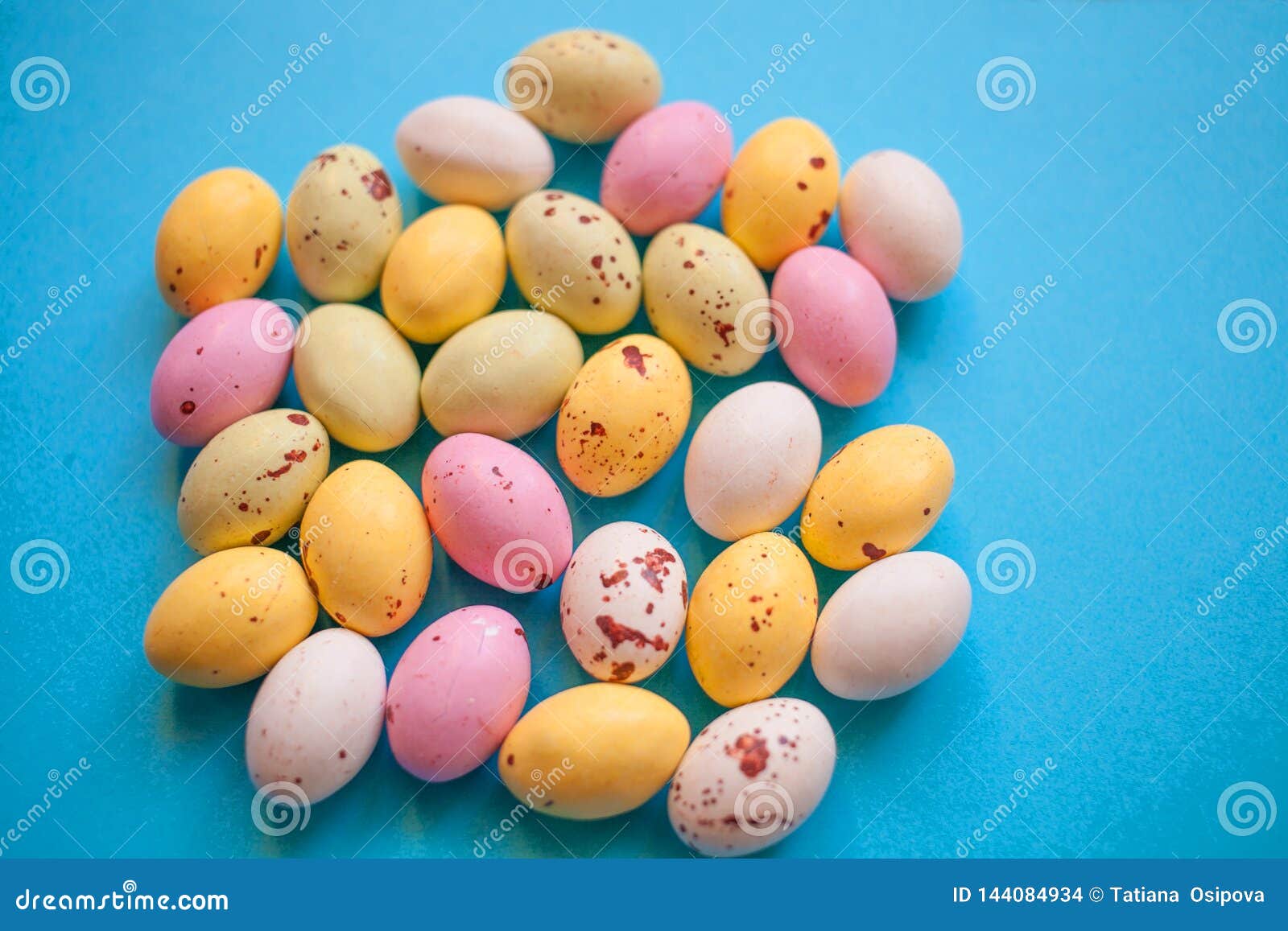 Happy Easter Little Yellow White and Pink Eggs on a Blue Background ...