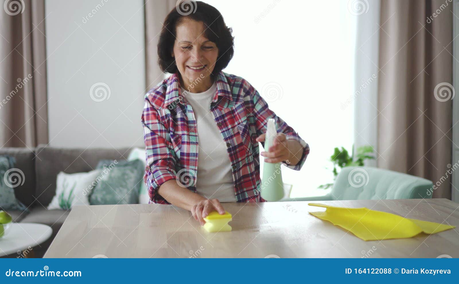https://thumbs.dreamstime.com/z/happy-elderly-american-woman-cleaning-table-home-living-room-old-female-wash-wooden-desk-holding-bottle-detergent-hand-164122088.jpg