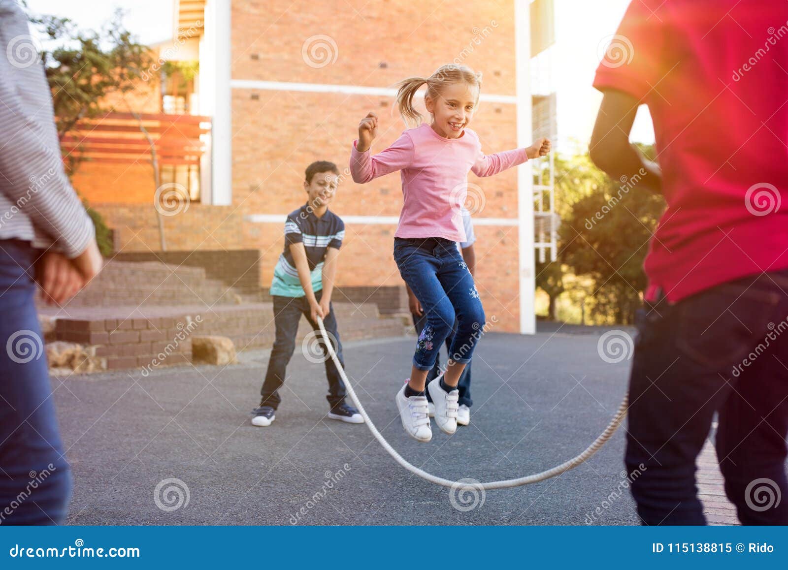 Children Playing with Skipping Rope Stock Image - Image of recreational