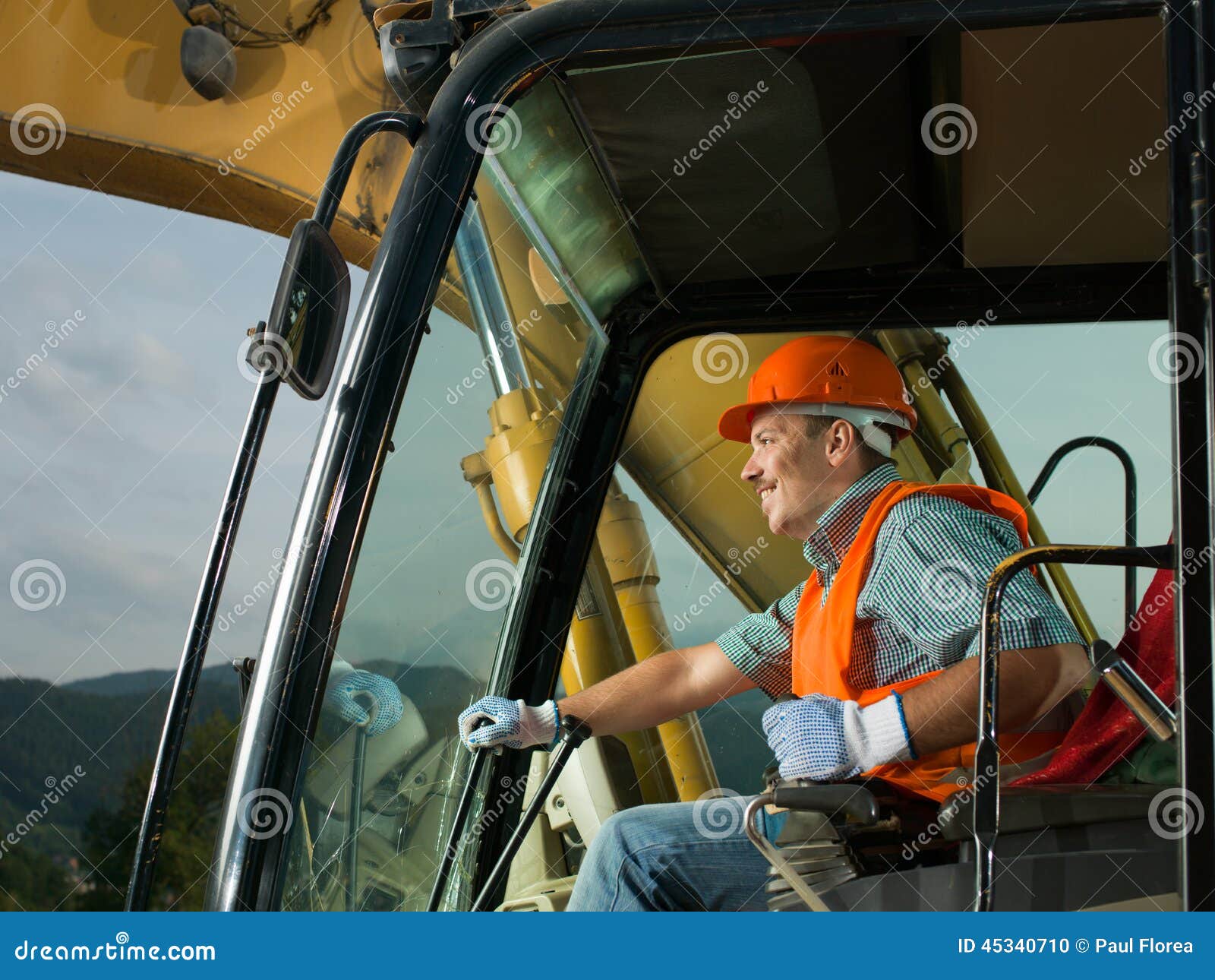 Excavator Driver Man Operator With Metal Tracks Unloading Soil At