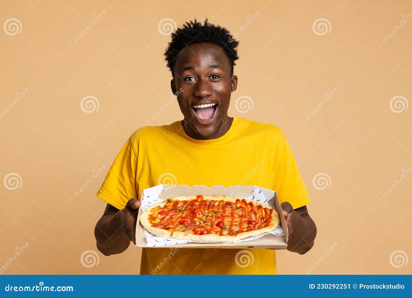 Happy african american friends eating pizza at home Stock Photo by  Prostock-studio