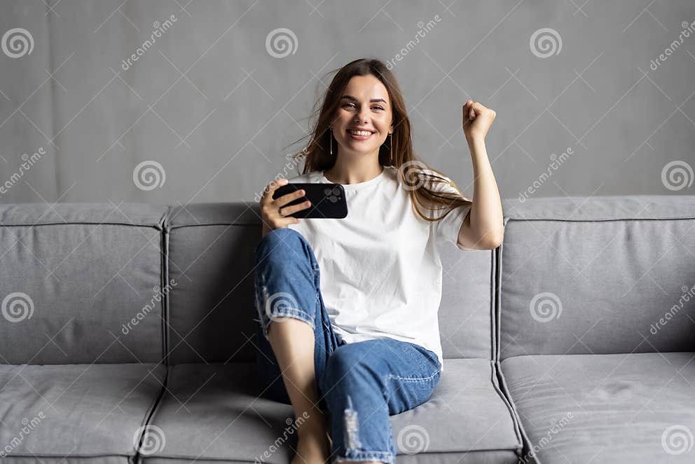 Happy excited smartphone user shouting for joy getting good news