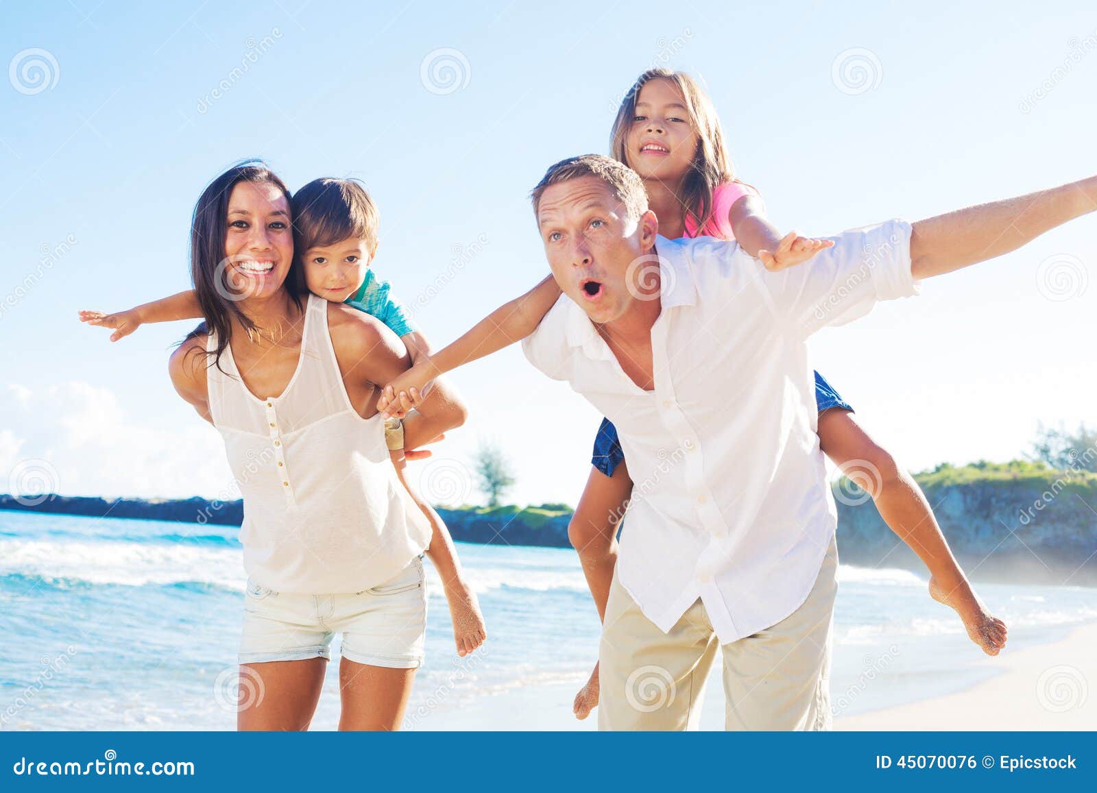 Happy Family on the Beach stock photo. Image of father 45070076