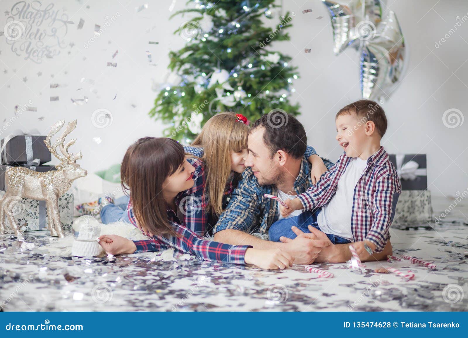 Happy Family in Checkered Shirts Rejoices at the New Year, Christmas ...