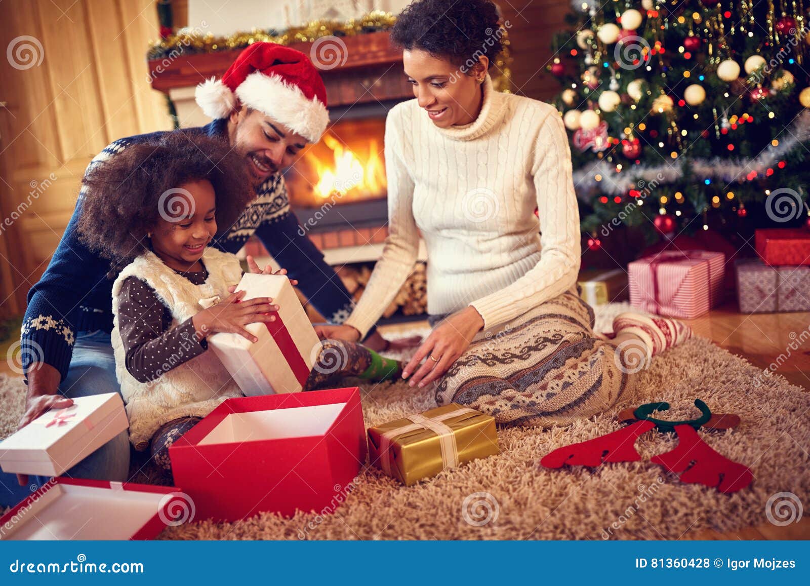 Download Happy Family In Christmas Morning Opening Present Stock Image of giving home