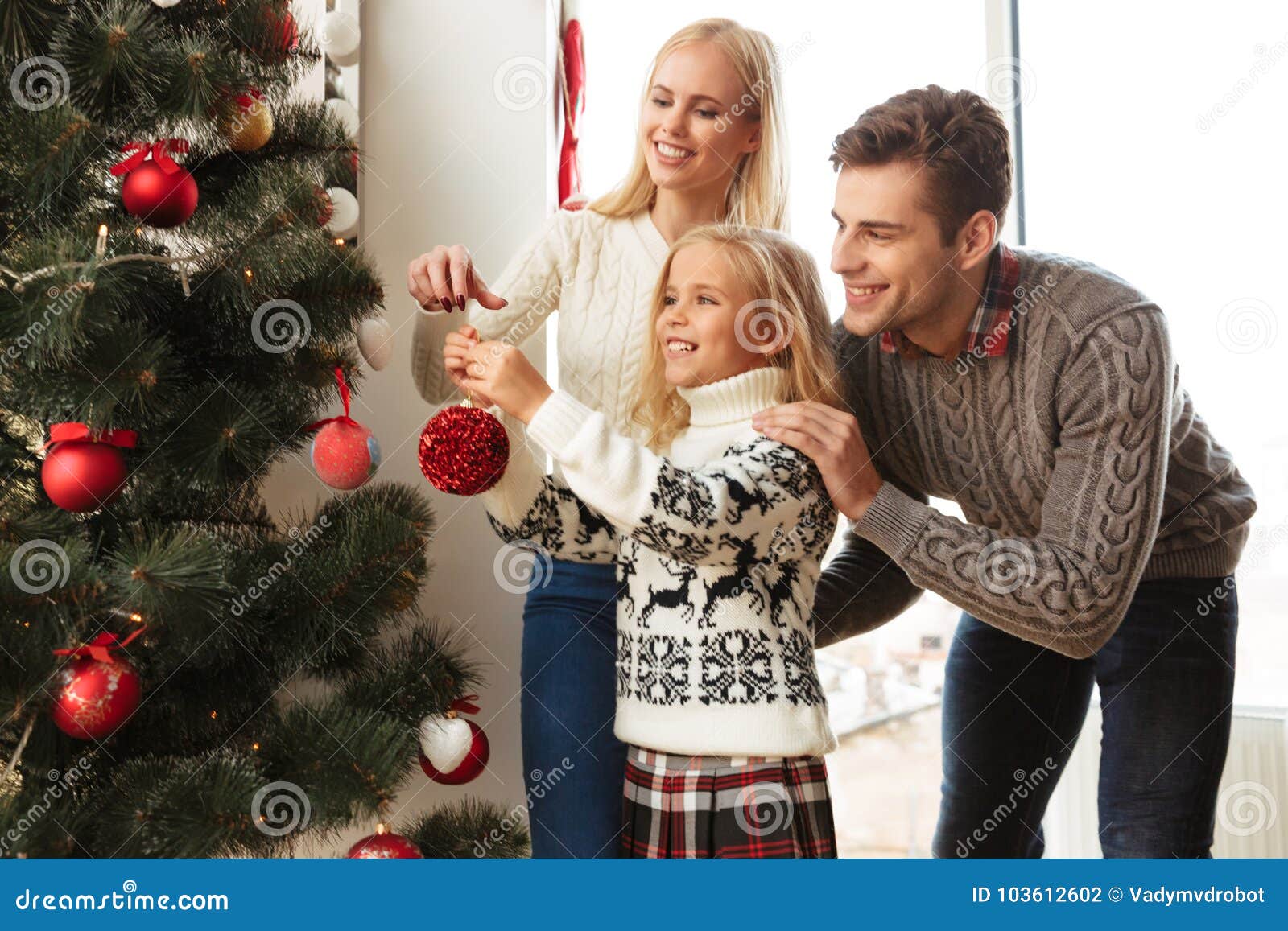 Happy Family Decorating Christmas Tree at Home Stock Photo - Image of ...