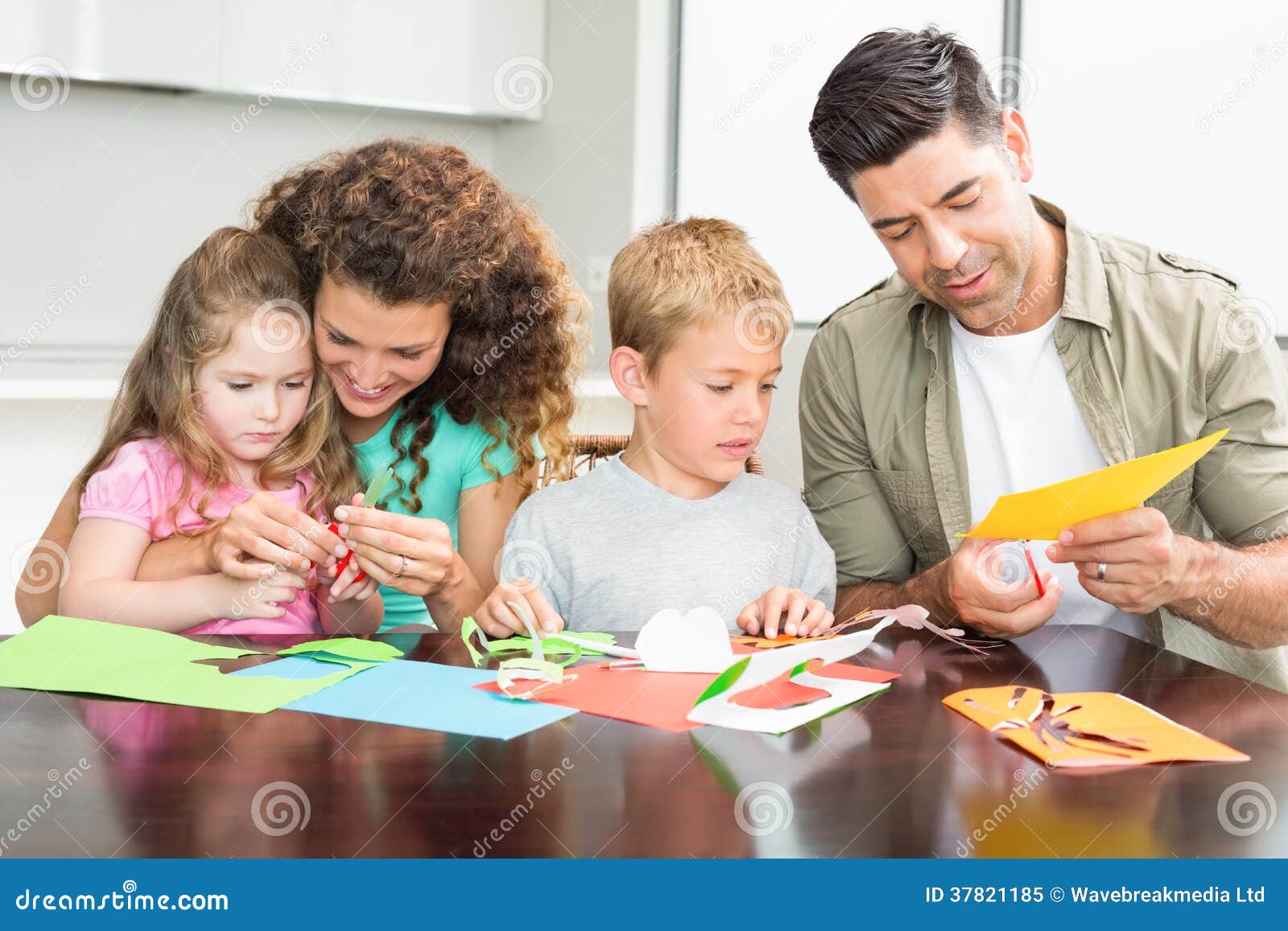 Happy Family Doing Arts And Crafts Together At The Table Royalty Free 