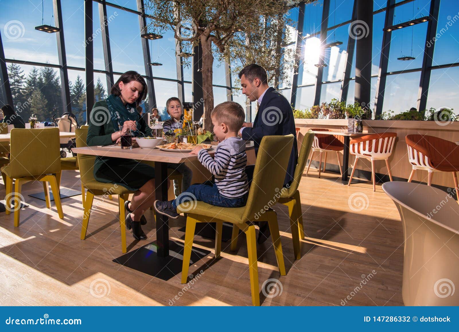 Happy Family Enjoying Lunch Time Together Stock Photo - Image of meal