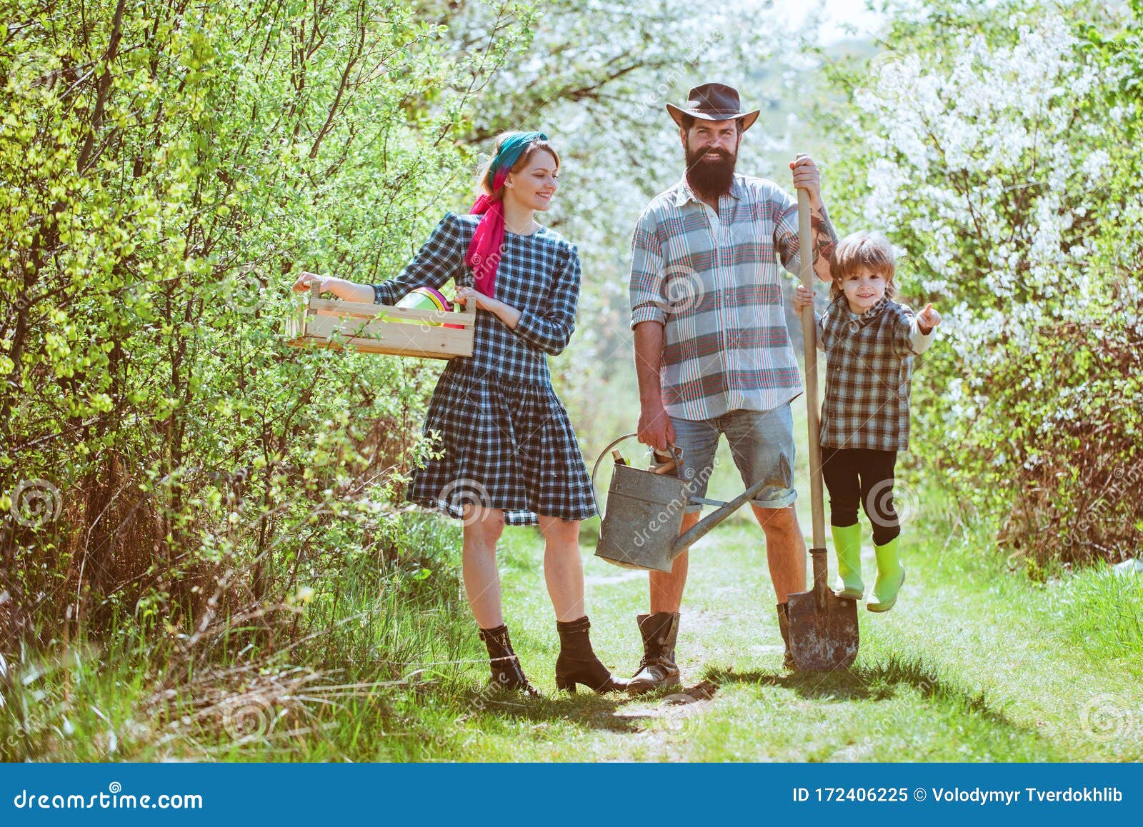 Happy Family on Farm. Family Gardening in the Backyard Garden. Happy