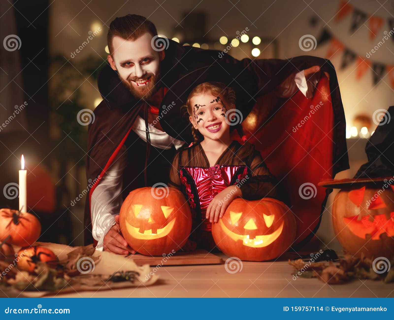 Happy Family Father and Child Daughter in Costumes and Makeup on