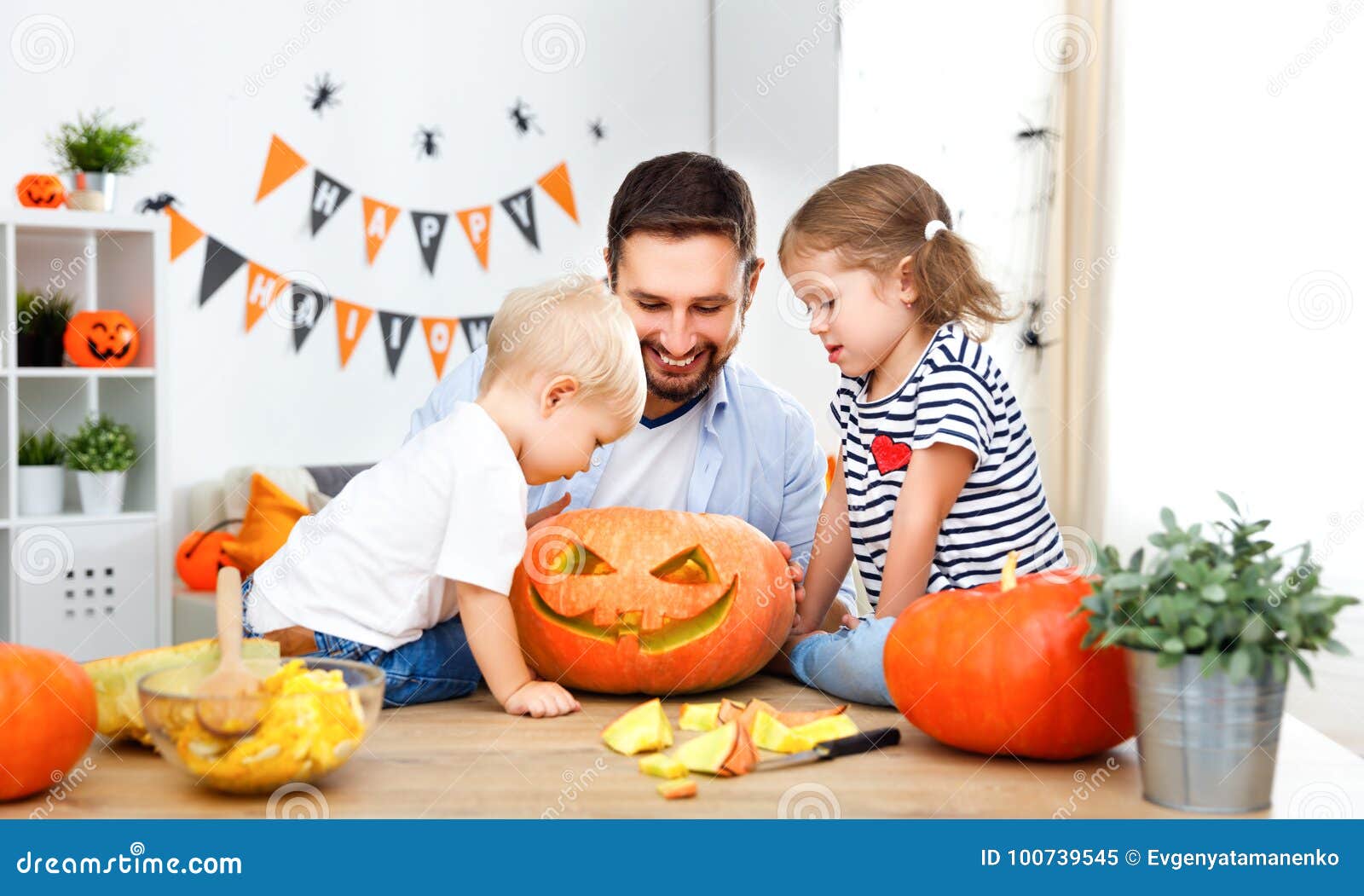 Happy Family Father and Children Cut Pumpkin for Halloween Stock Image ...