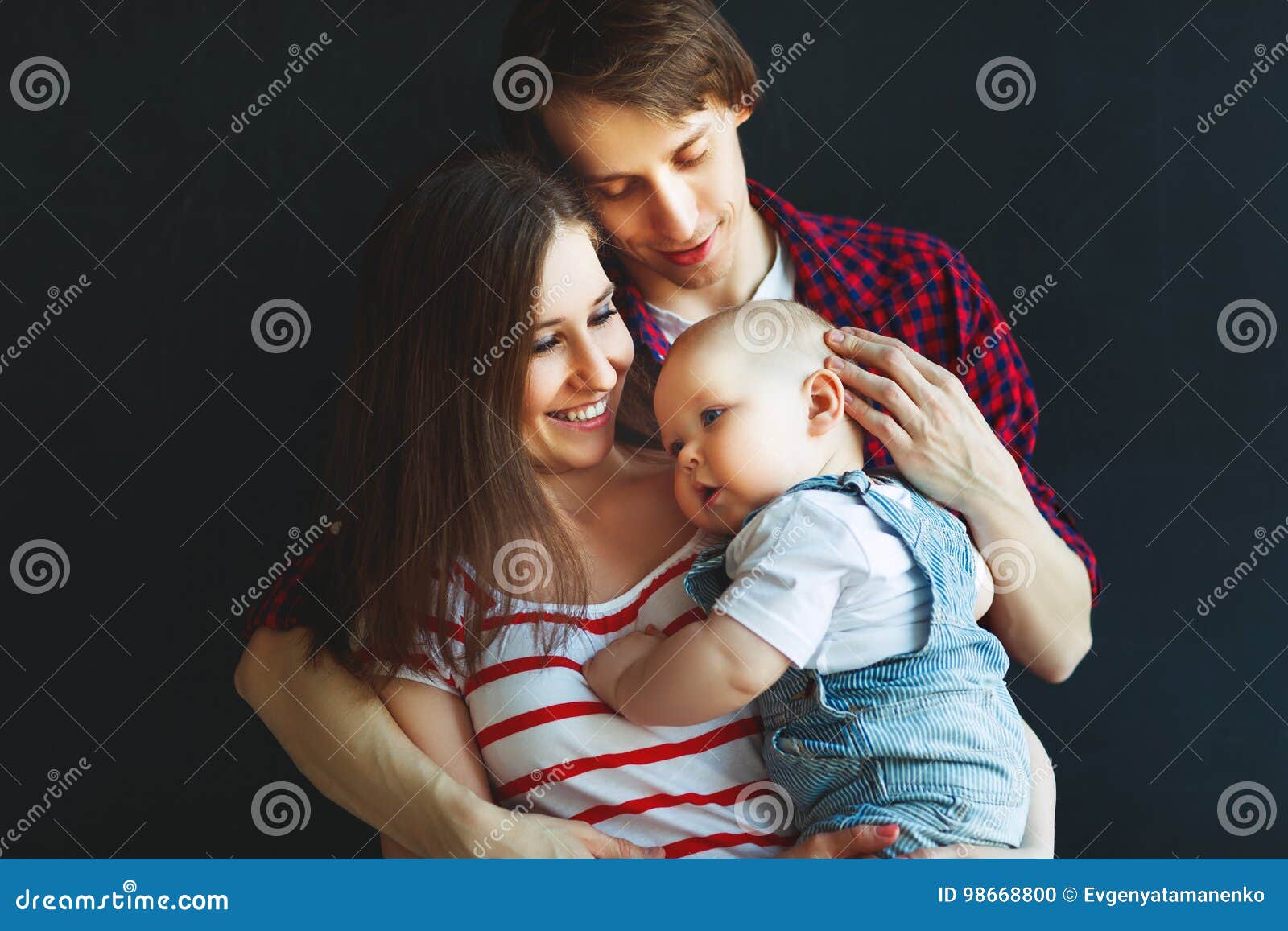 Happy Family Father Mother and Baby Son on Black Background Stock ...