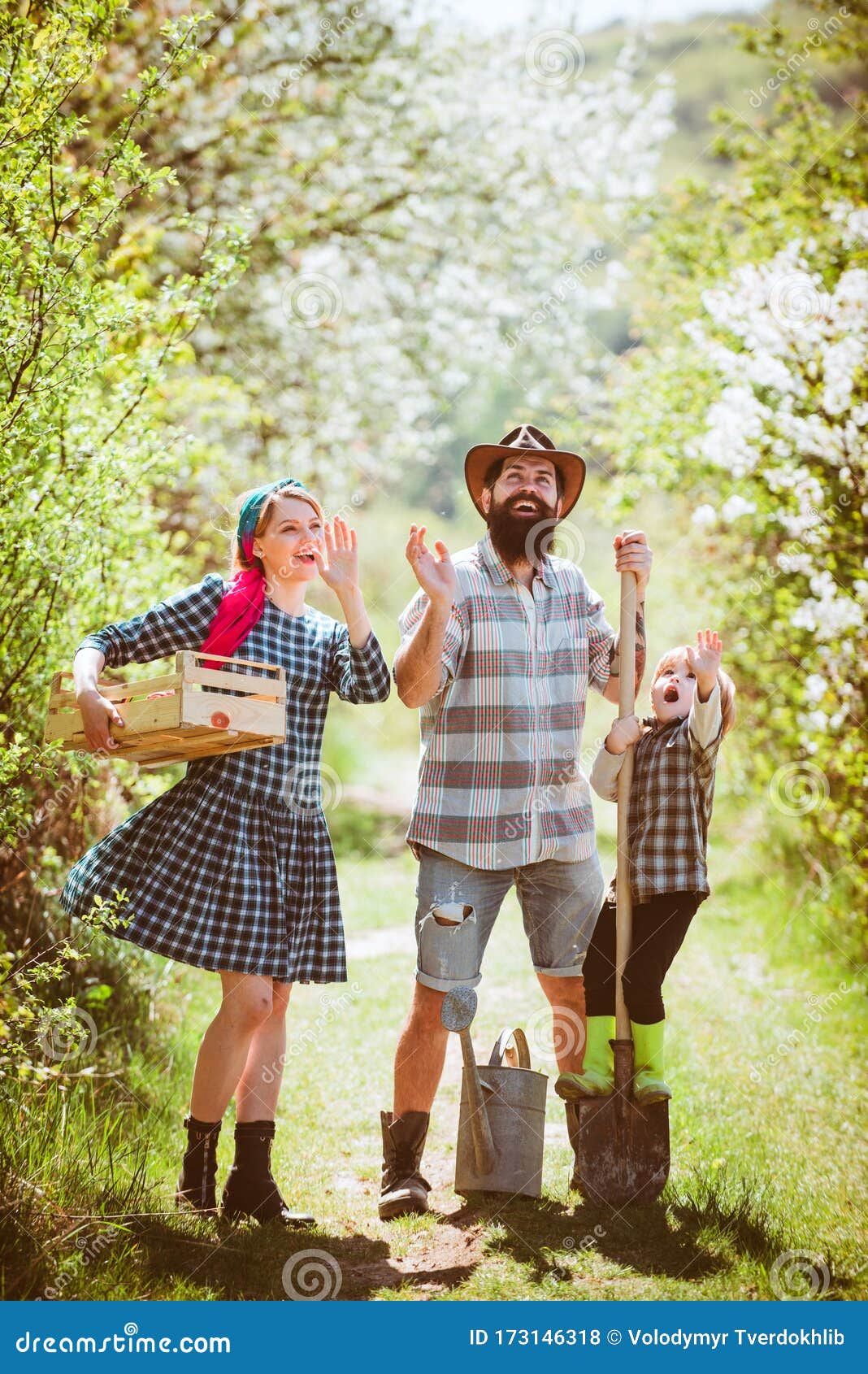 Happy Family in Garden. Happy Family in Vegetable Garden. Family