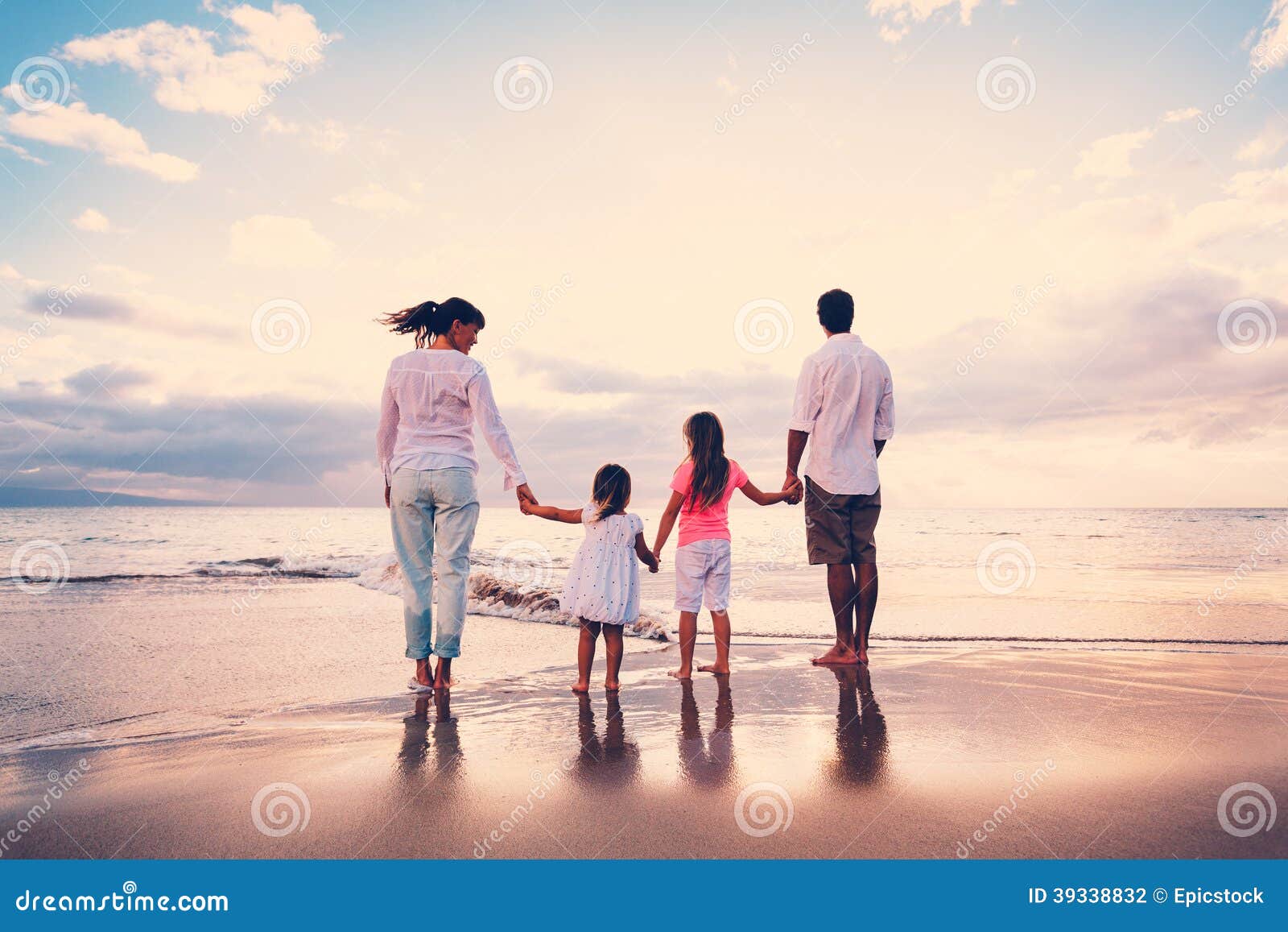 happy family have fun walking on beach at sunset
