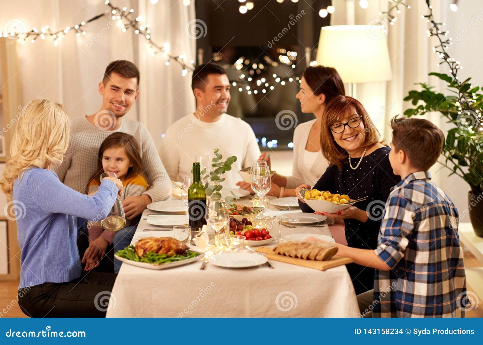 Happy Family Having Dinner Party at Home Stock Photo - Image of