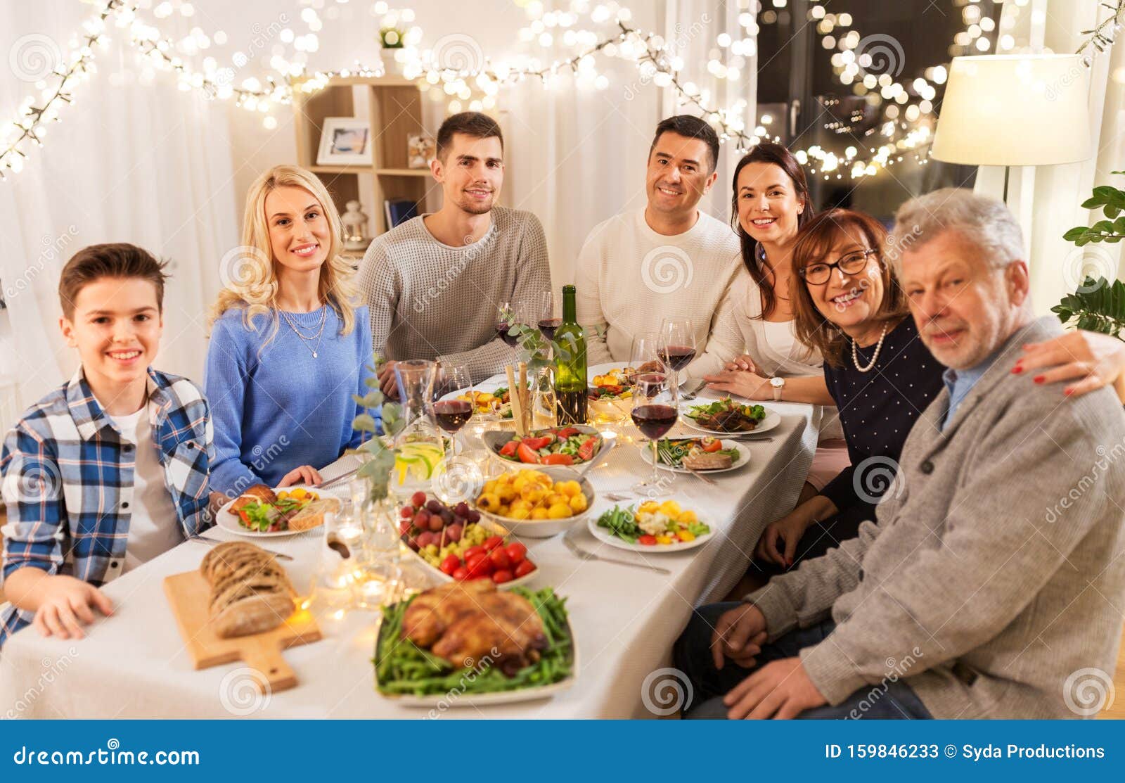 Happy Family Having Dinner Party At Home Stock Image - Image of festive