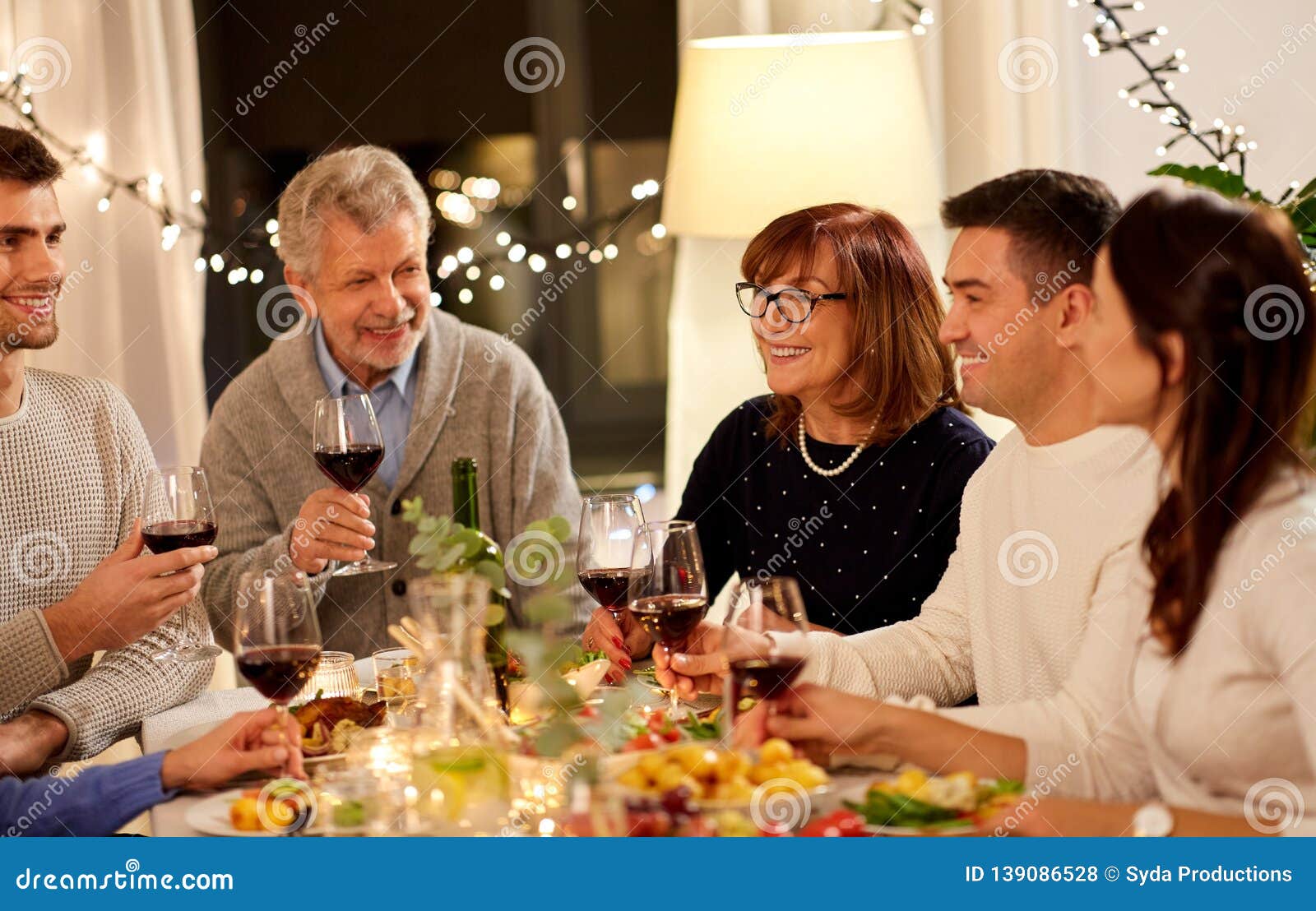 Happy Family Having Dinner Party at Home Stock Photo - Image of drink