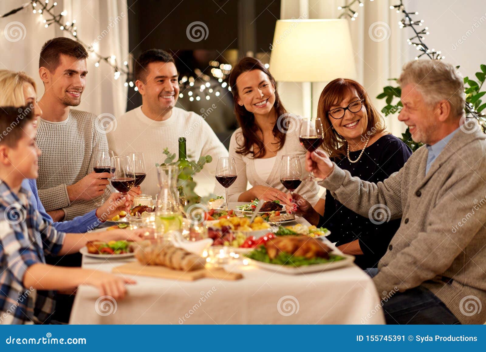Happy Family Having Dinner Party at Home Stock Image - Image of indoors