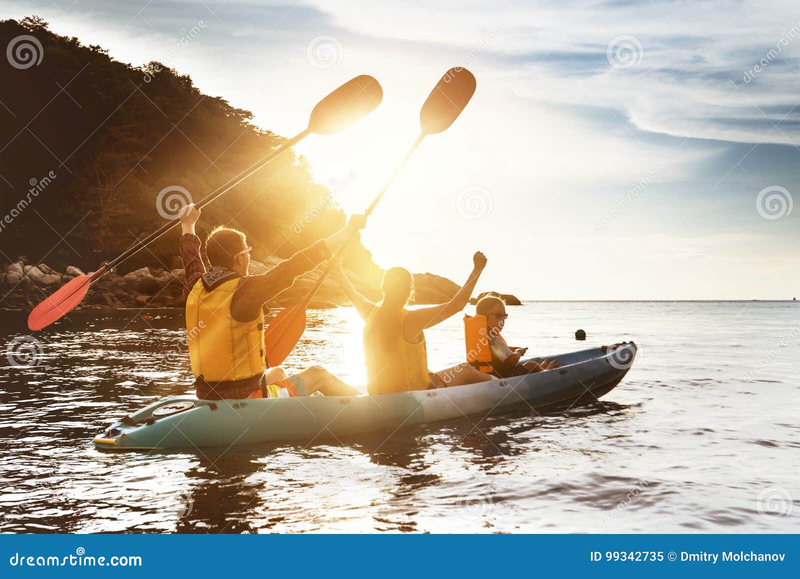 happy family kayaking sunset sea
