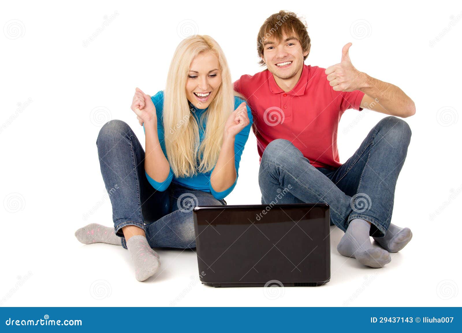 The happy family is looking into the notebook computer and rejoices isolated on white background