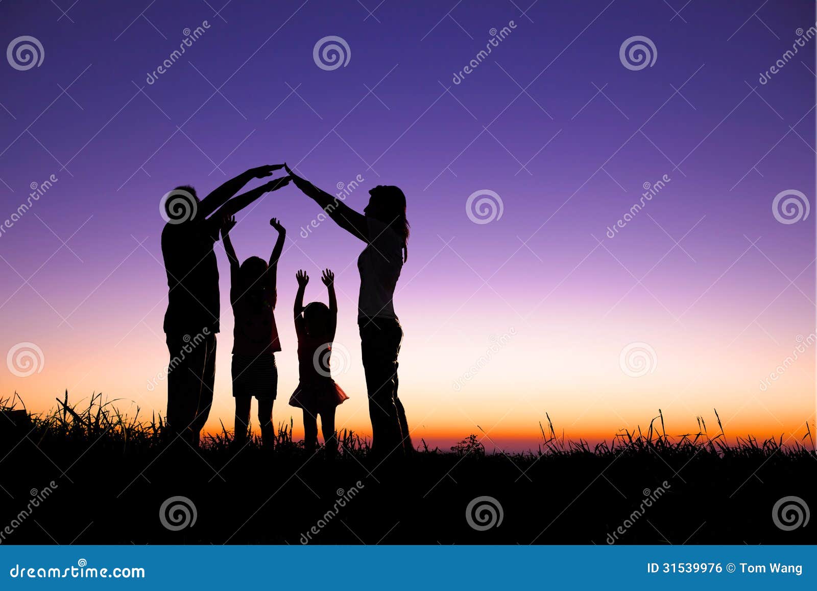 happy family making the home sign