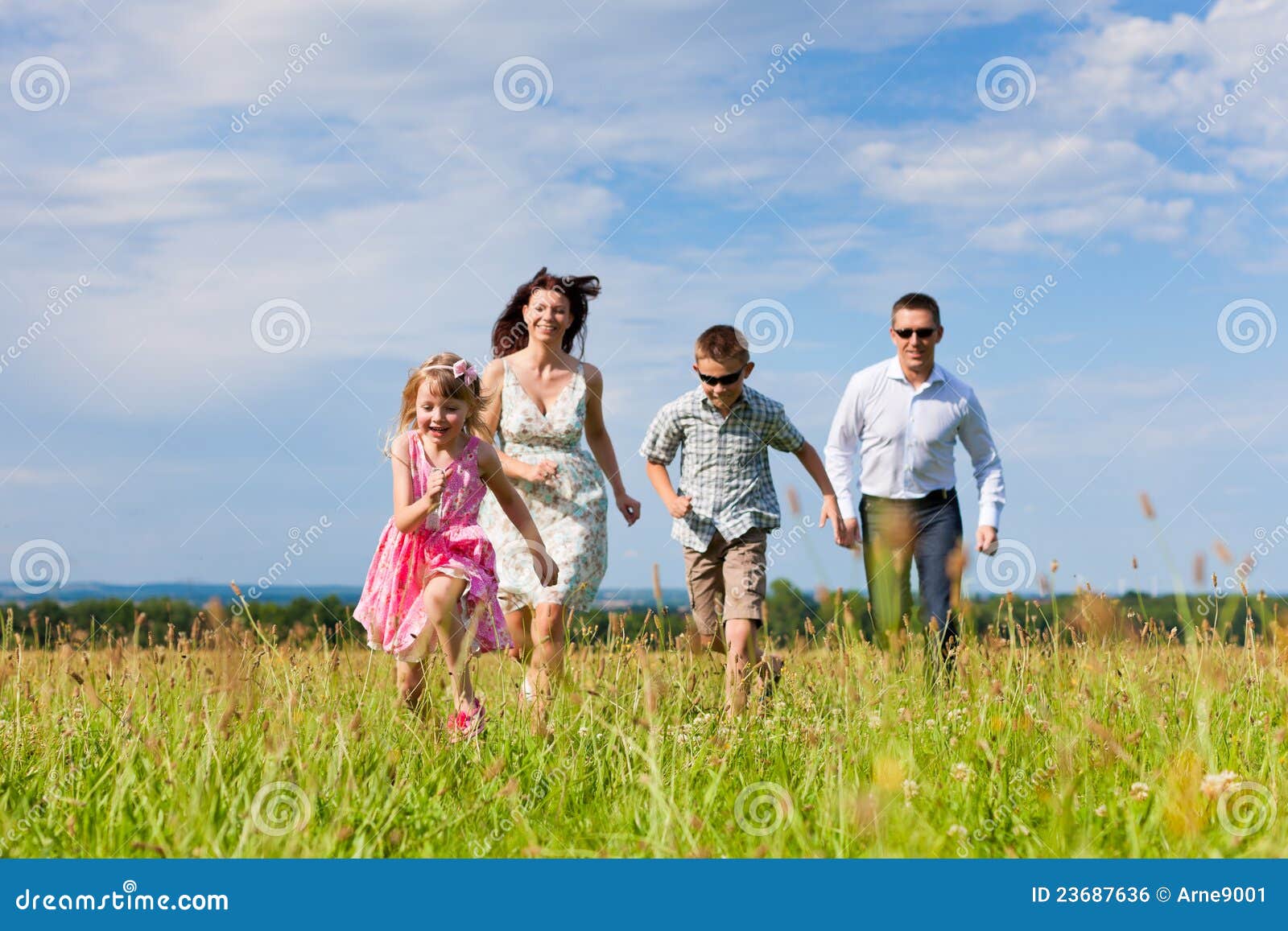 Happy family enjoying life together at meadow outdoor. Royalty-Free Stock  Image - Storyblocks