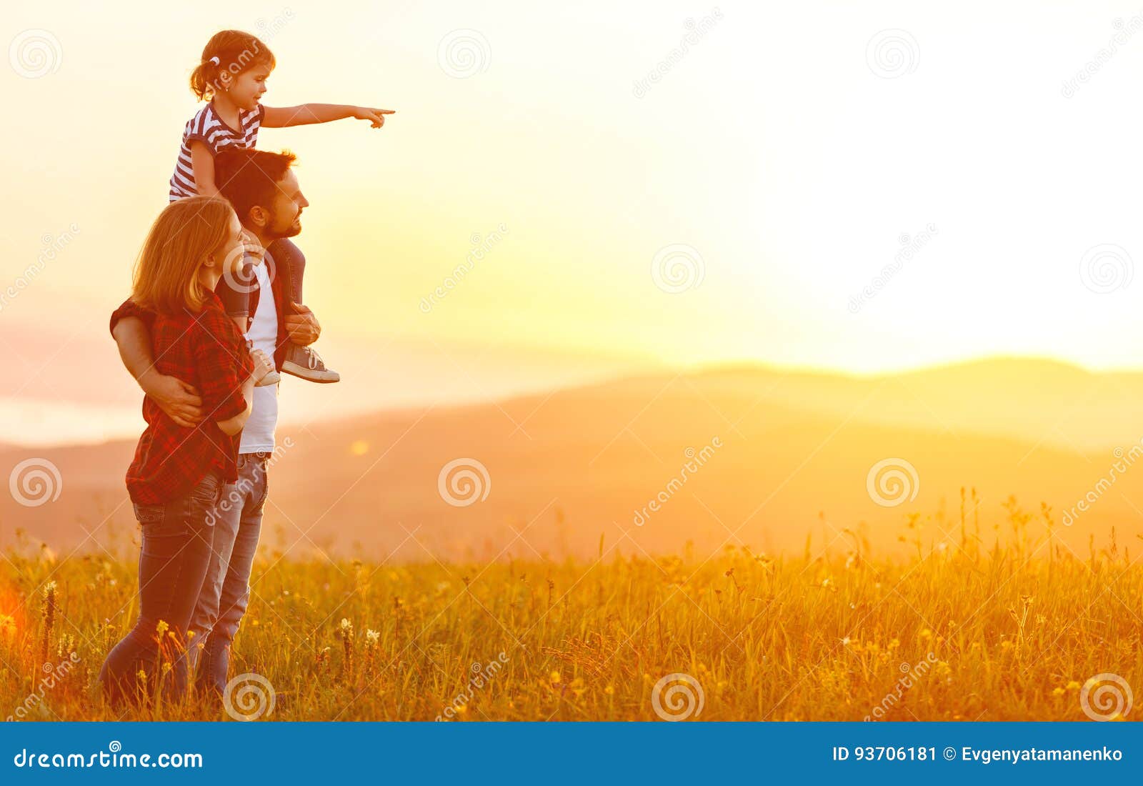 happy family: mother father and child daughter on sunset