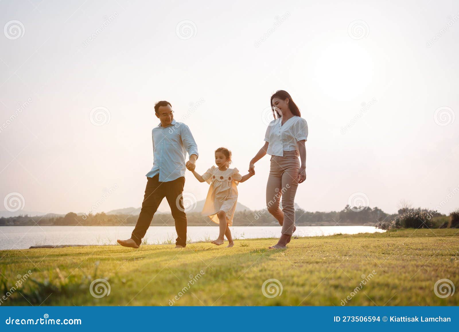 Happy Family in the Park Sunset Light. Family on Weekend Running ...