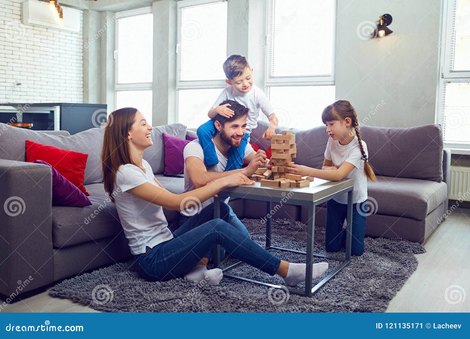 happy family playing board games at home.